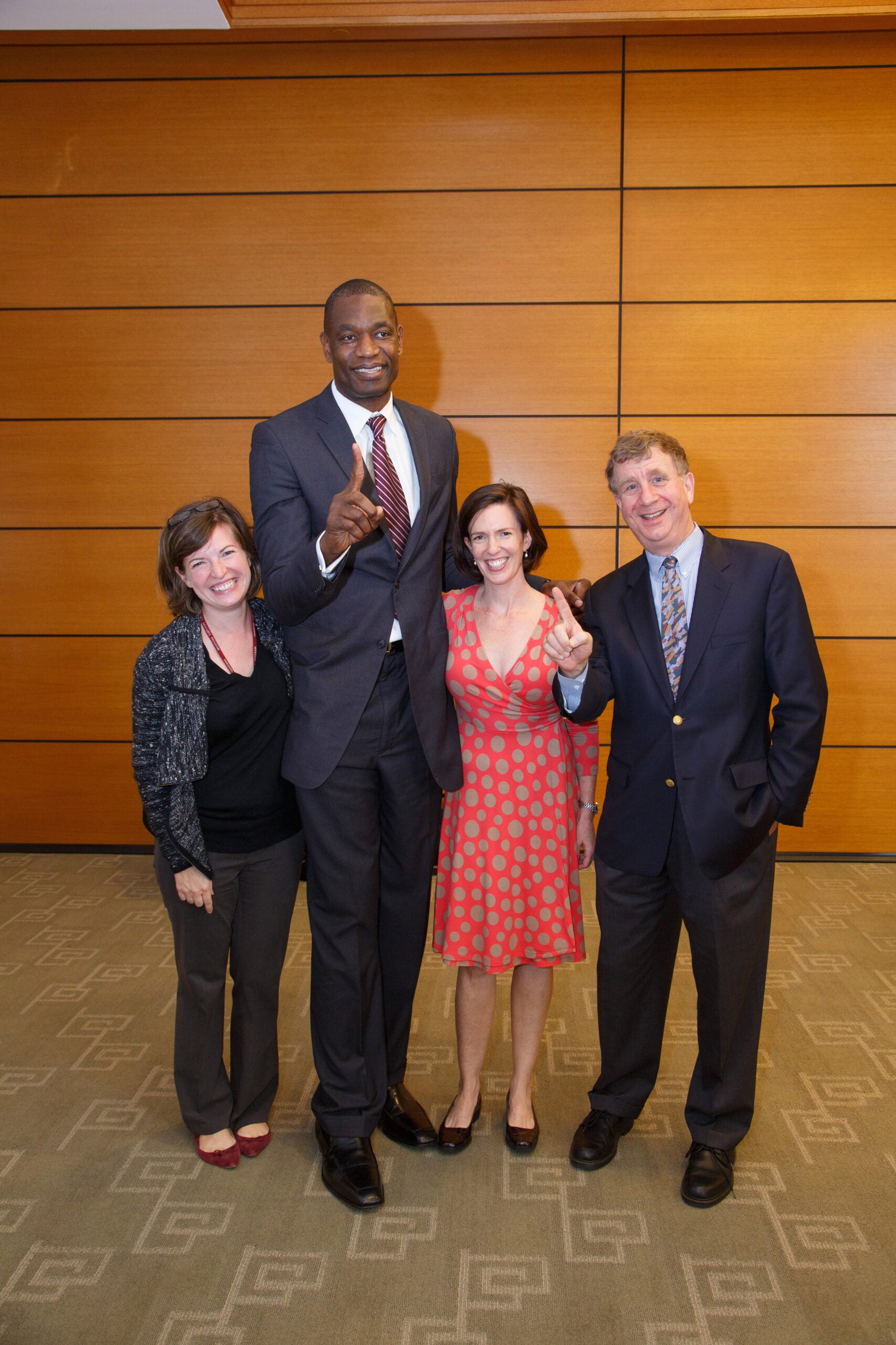 Two men and two women posing together