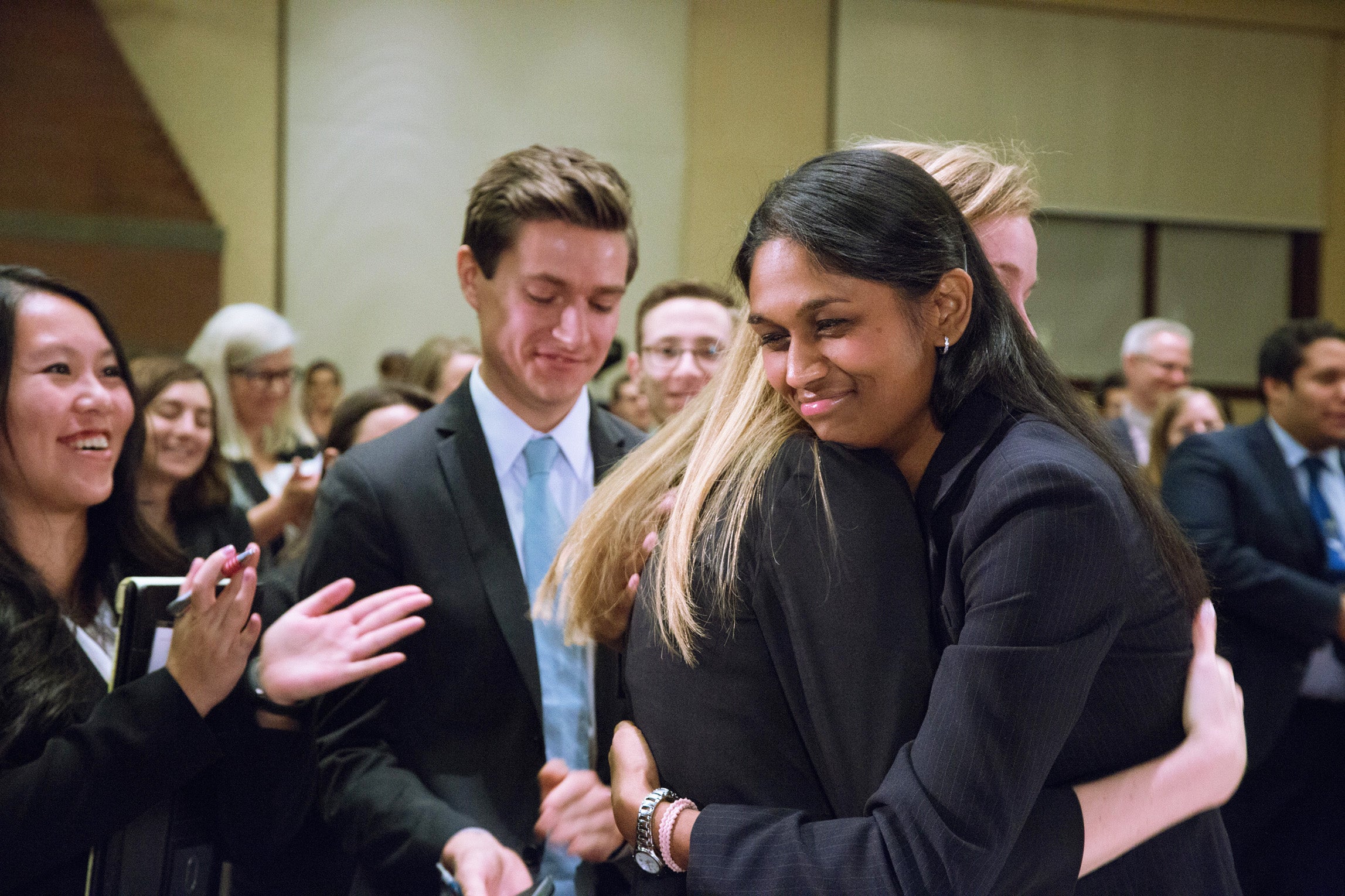 Teammates hugging after the trial