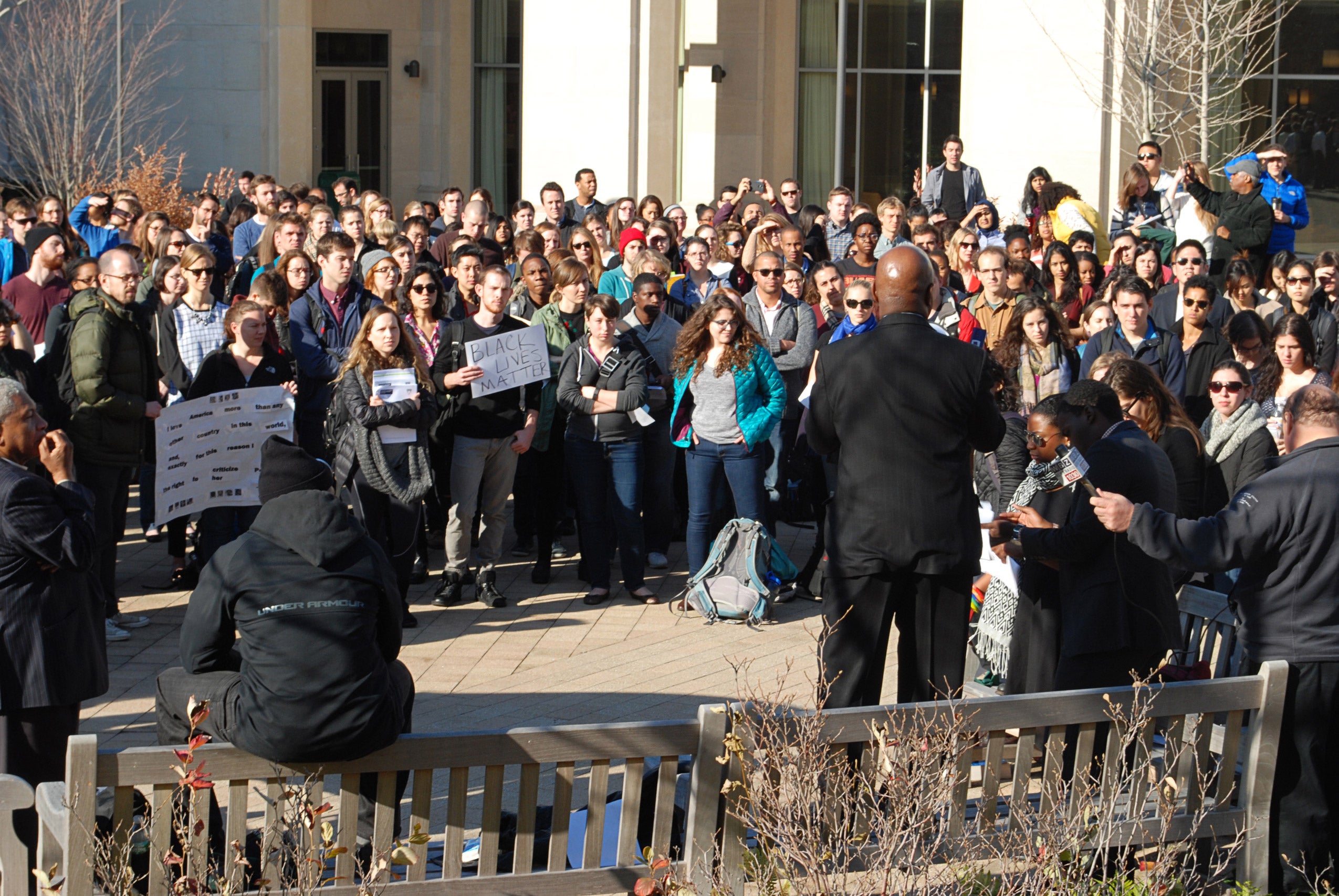 A man speaks to a crowd of protestors