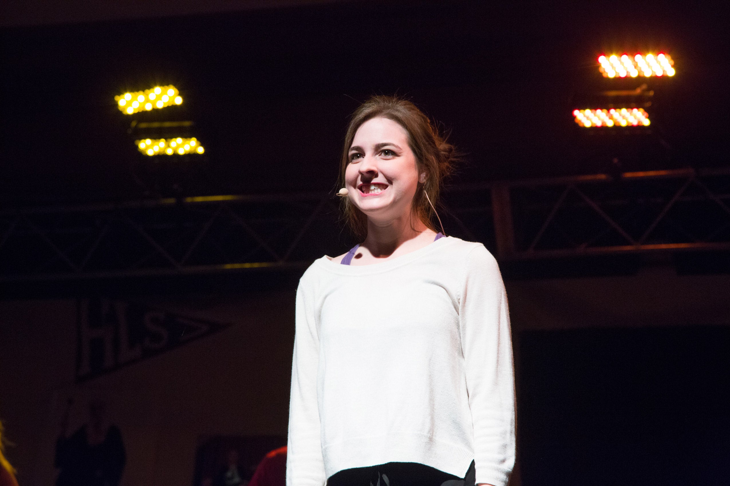 A woman standing on stage