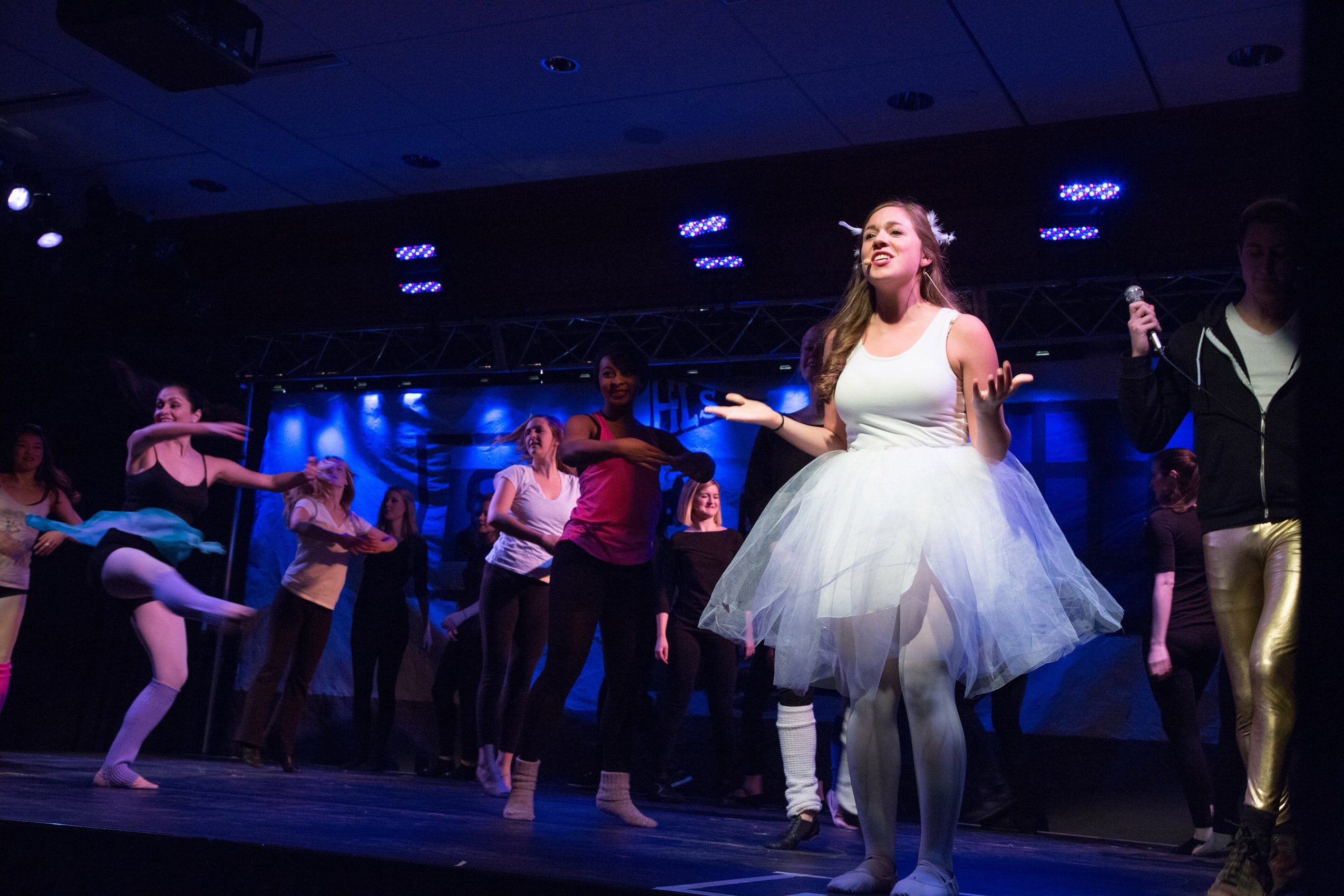 A group of people on stage performing
