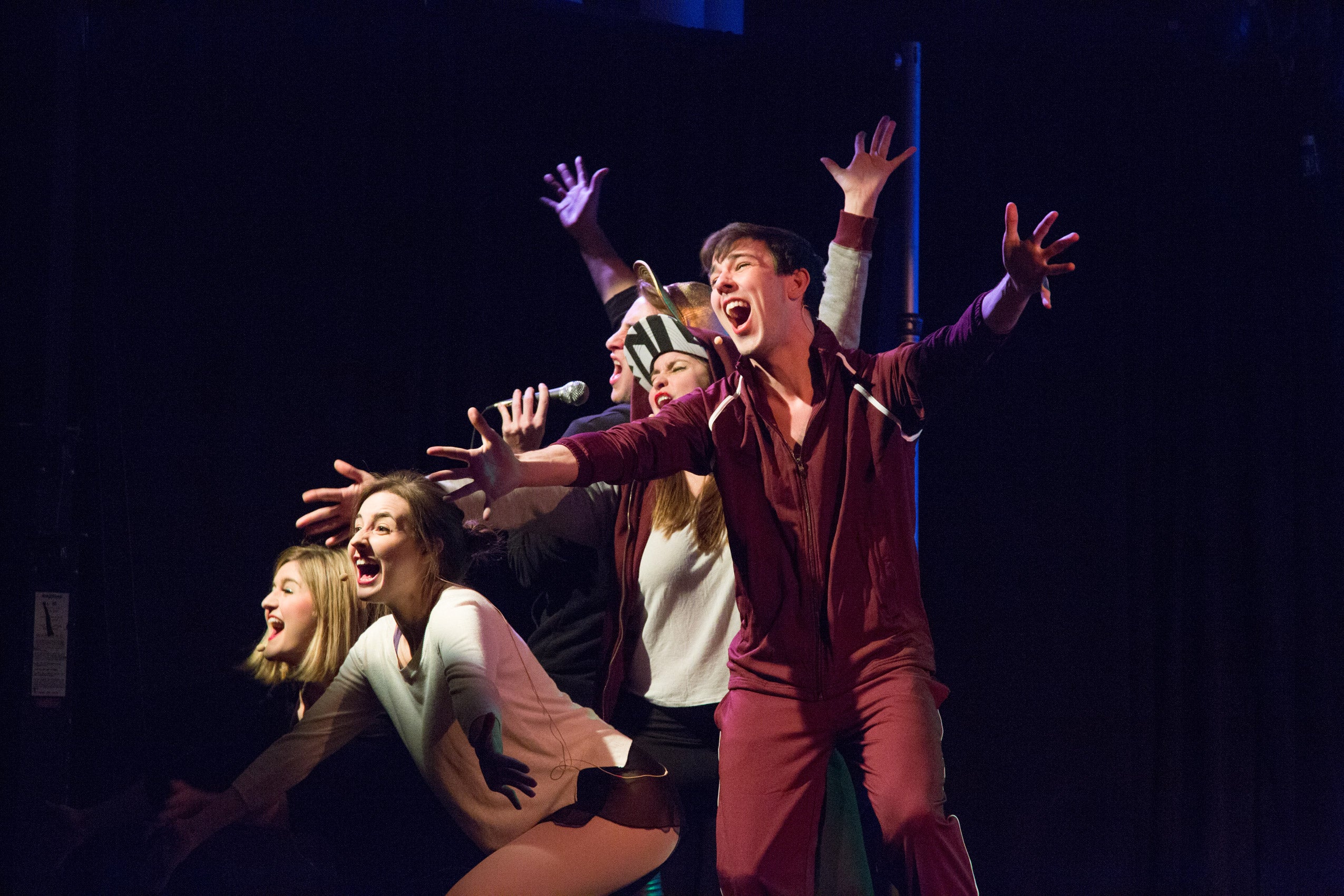 A group of students performing on stage