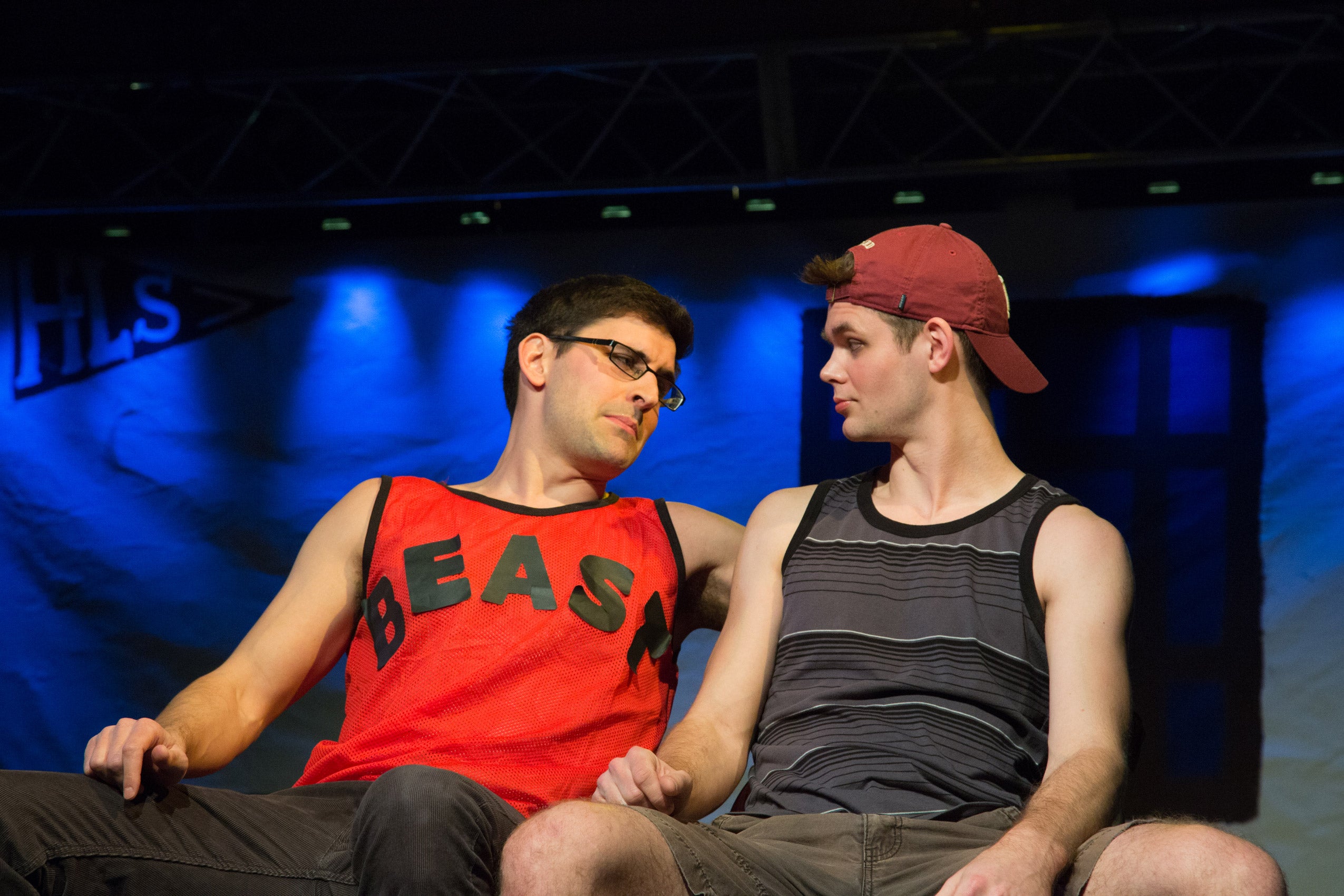 Two men looking at each other on stage