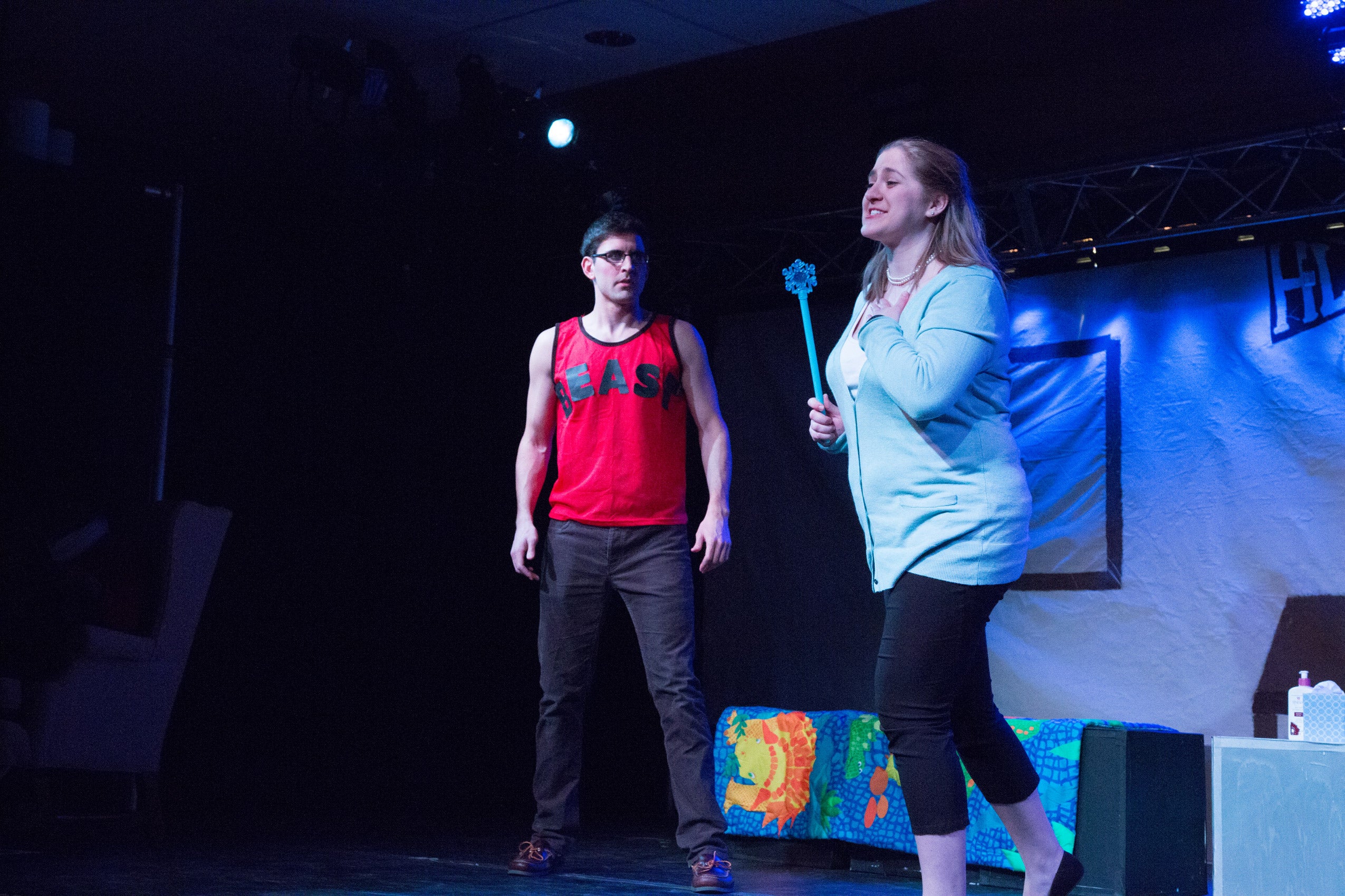 A man and a woman performing on stage