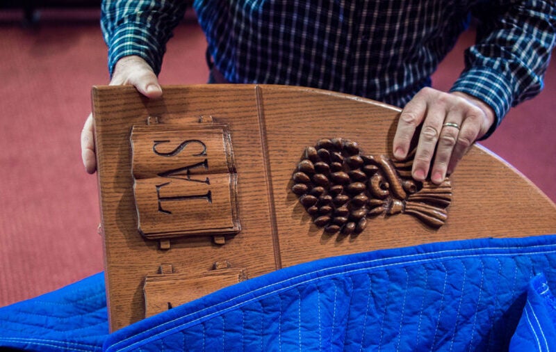 Pulling the wooden law shield out of its case