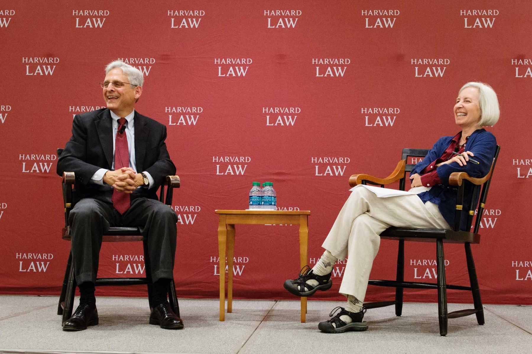 Merrick Garland speaking at the front of the room