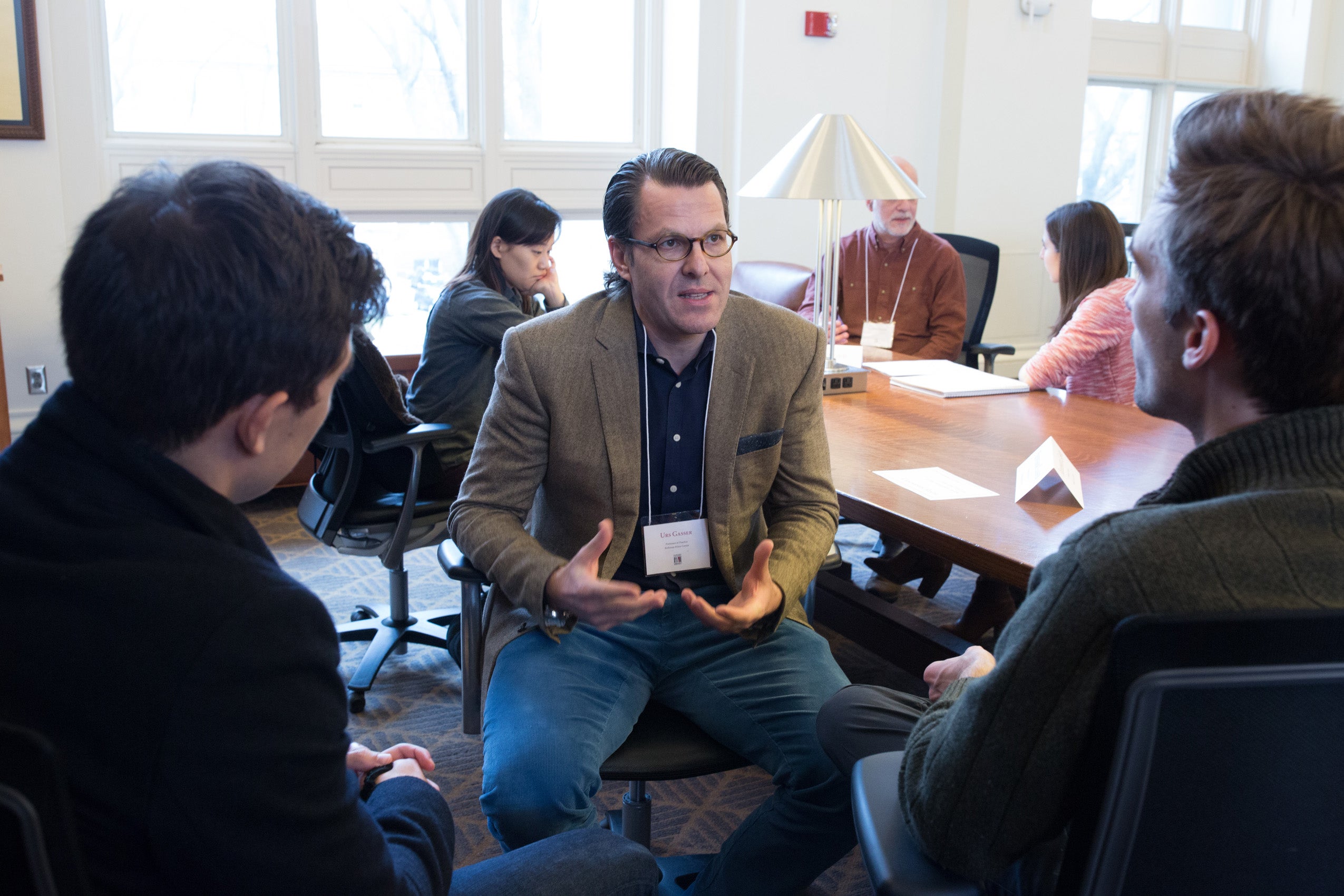 Three men having a conversation