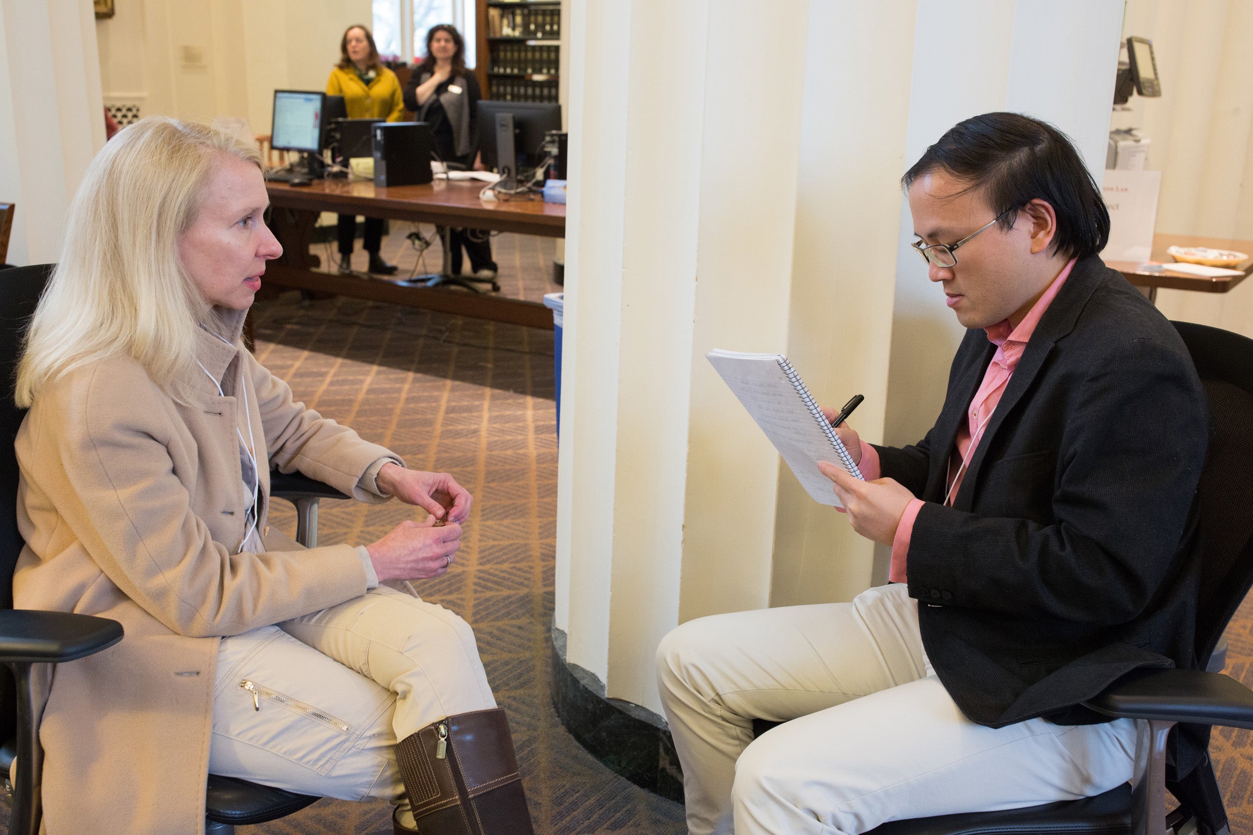 A man and a woman sitting together having a conversation