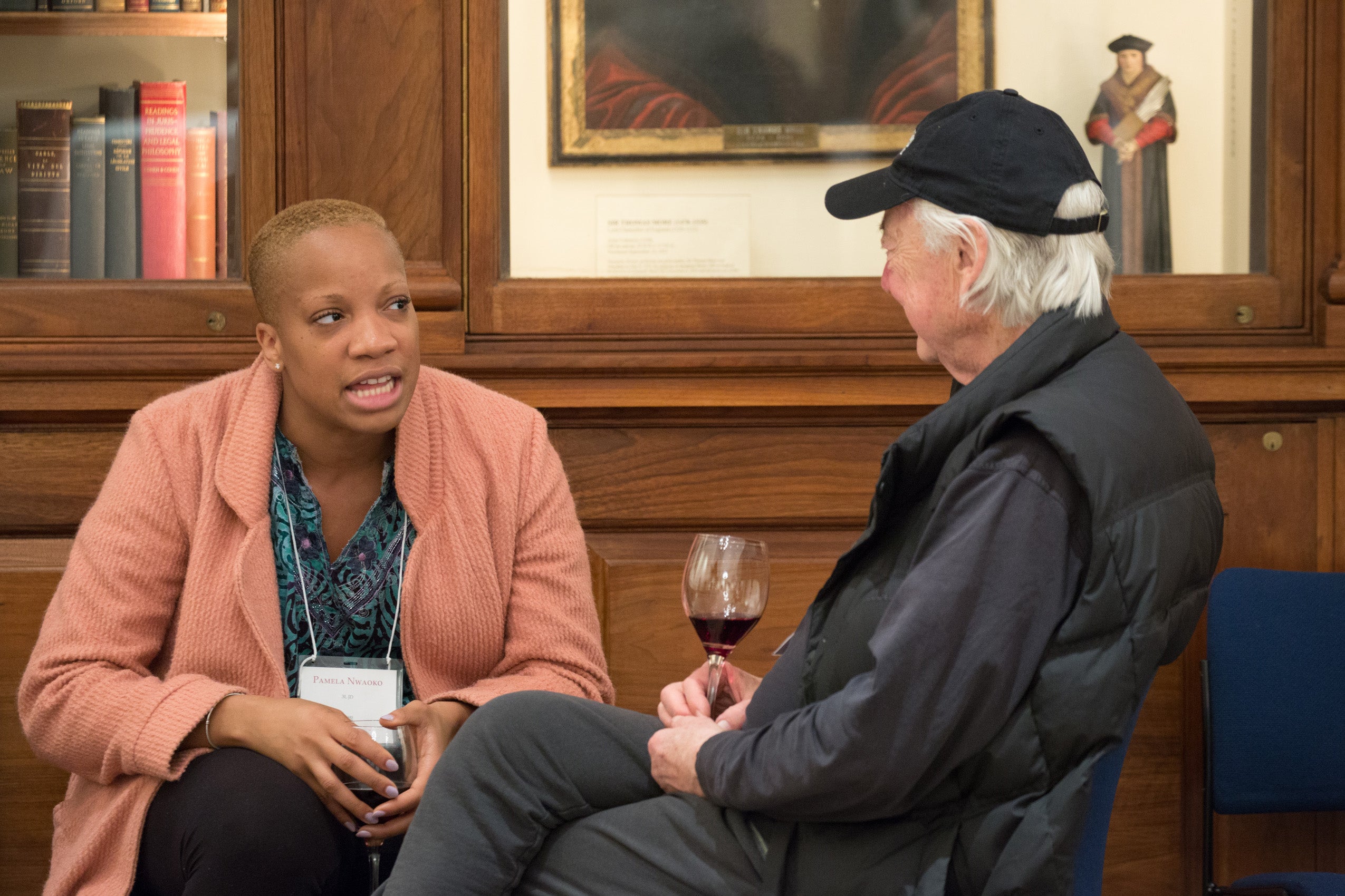 A man and a woman seated having a conversation