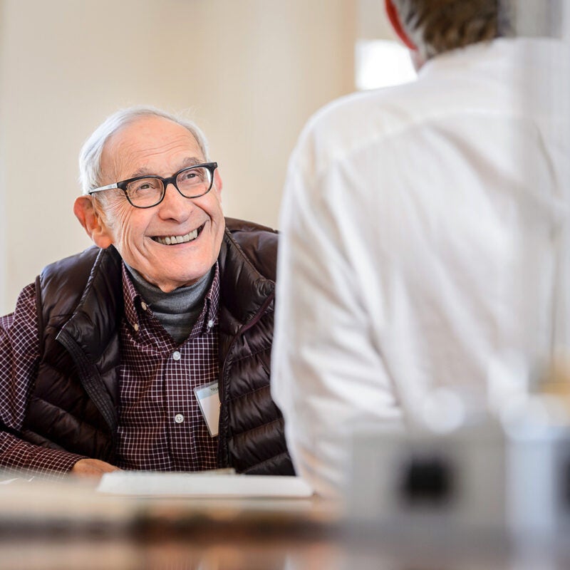 Charles Fried speaks with a student