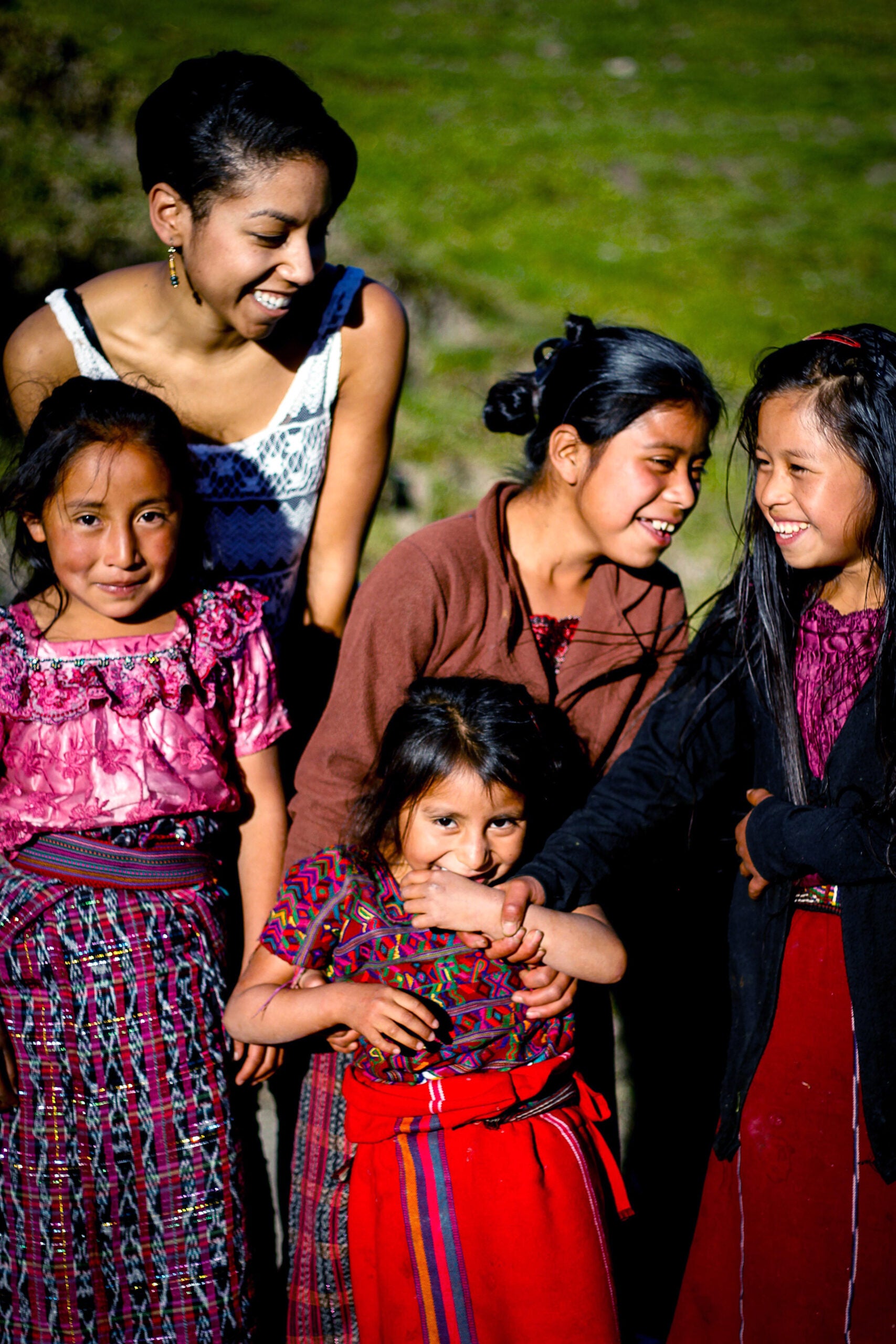 A law student posing with a group of young girls