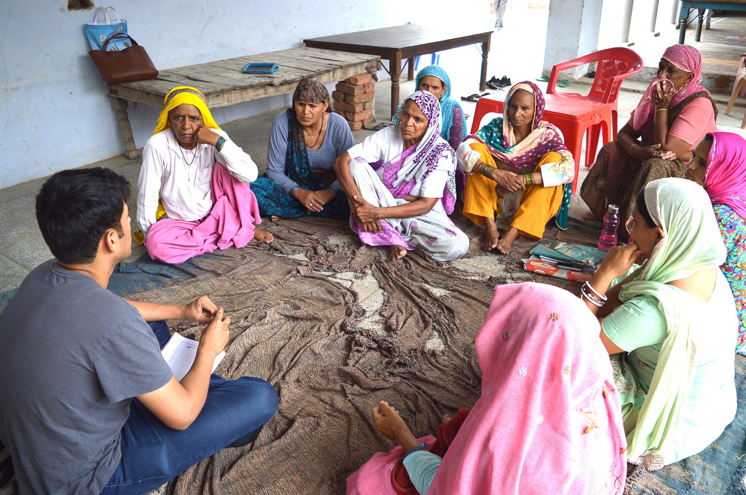 A group of people sitting on the floor