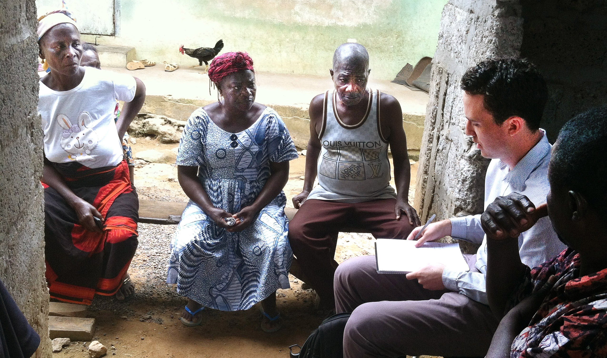 Five people sitting on the ground