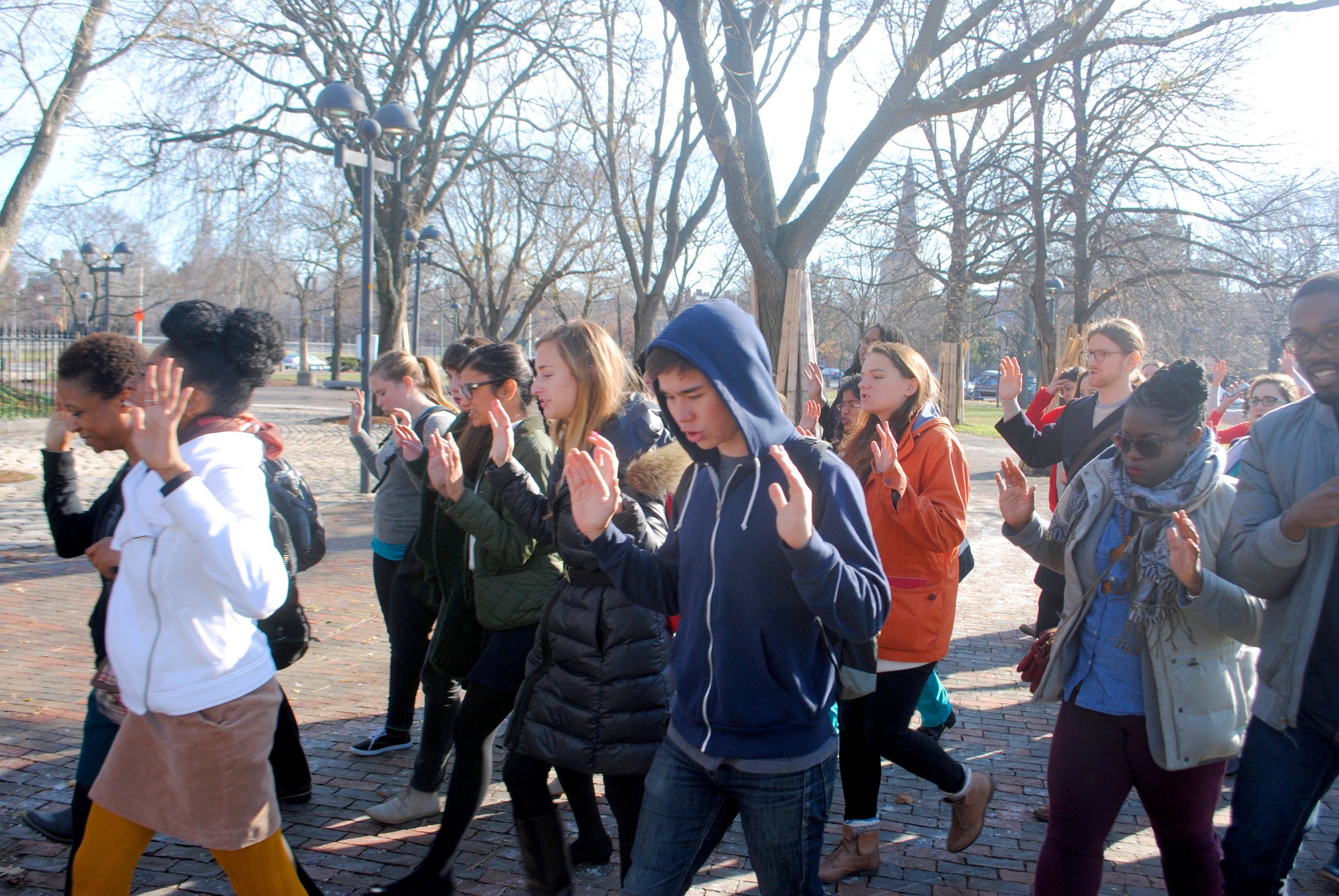 Students marching with their hands held up