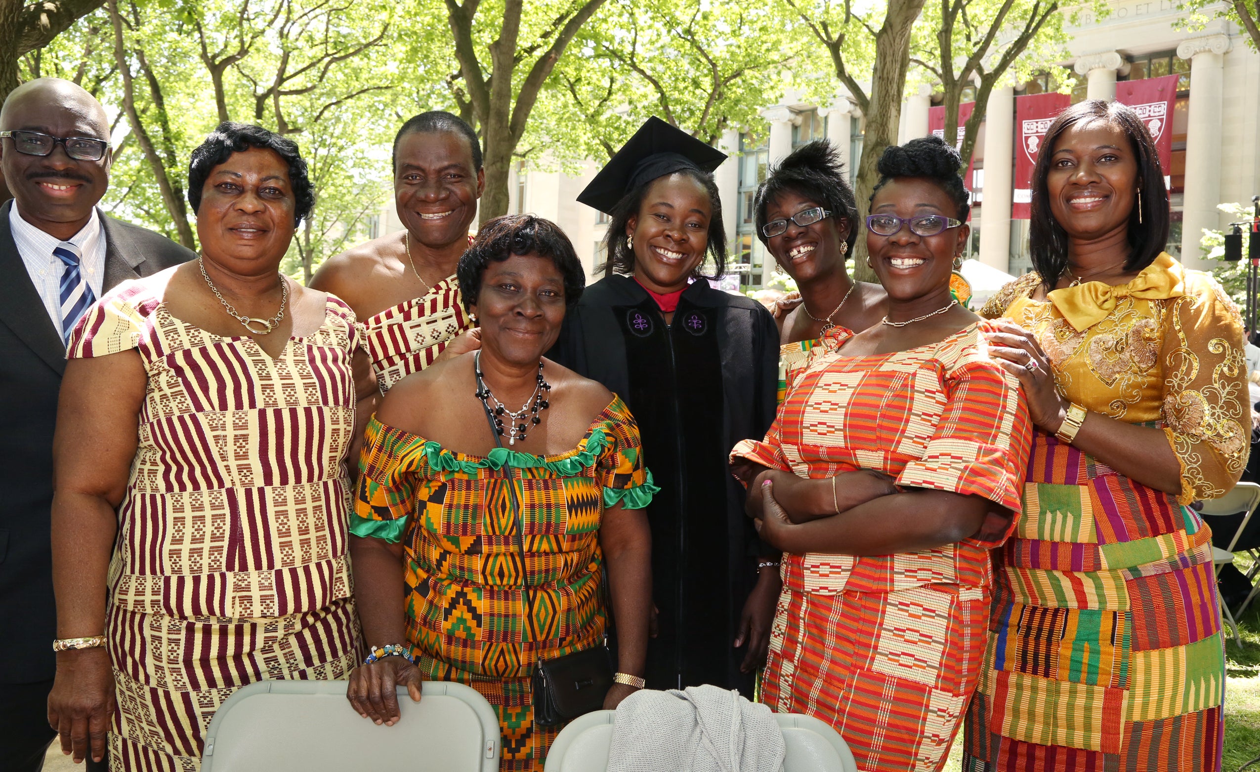 A group of people standing and smiling together