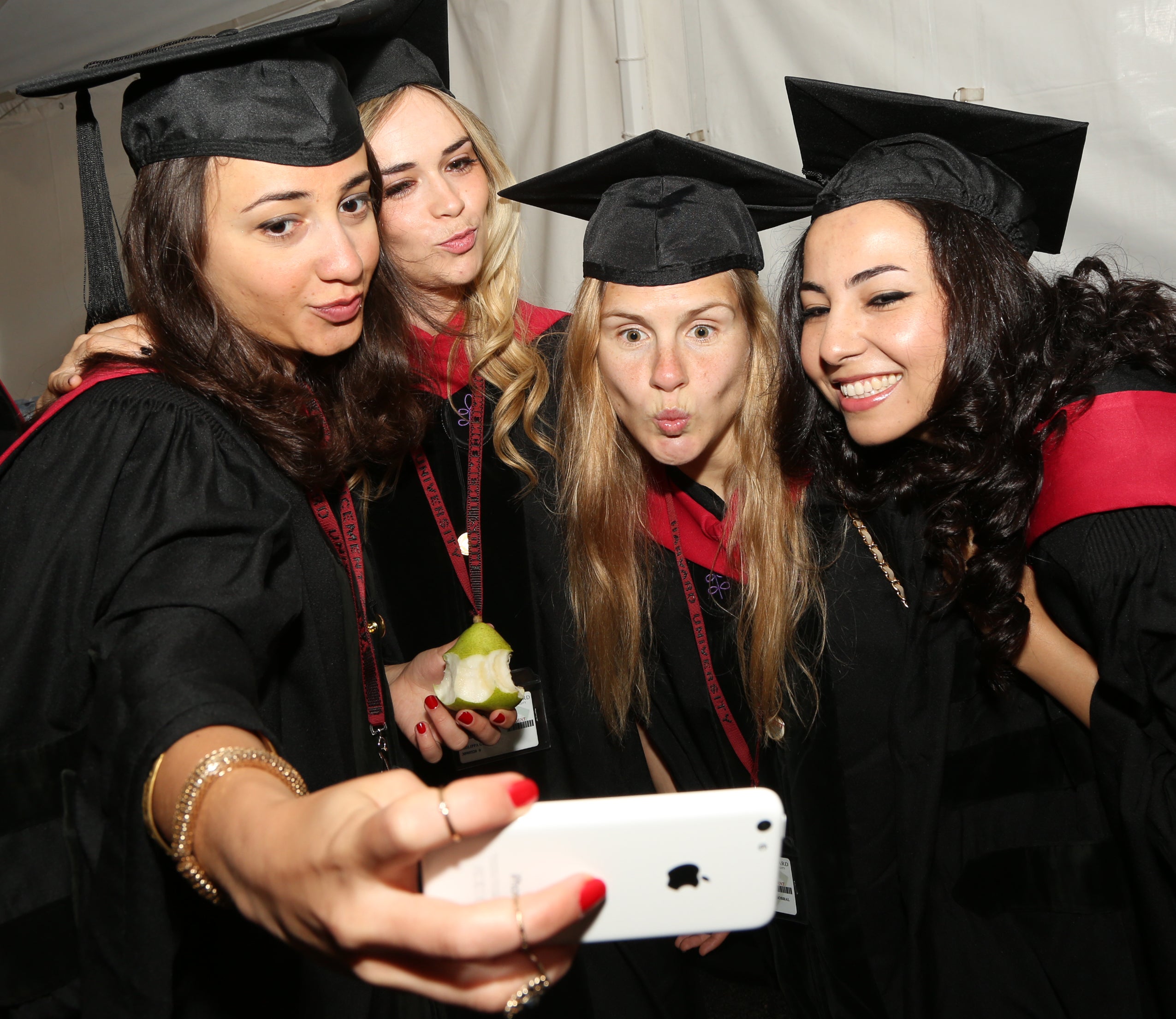 Four graduates taking a selfie