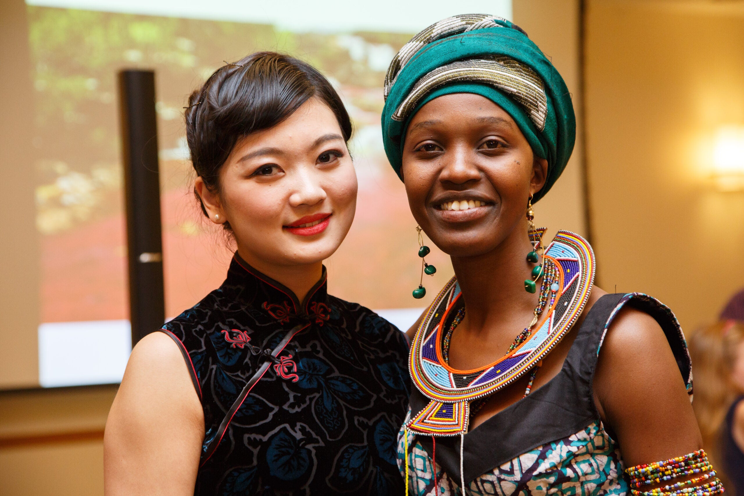 Two women posing together in traditional dress