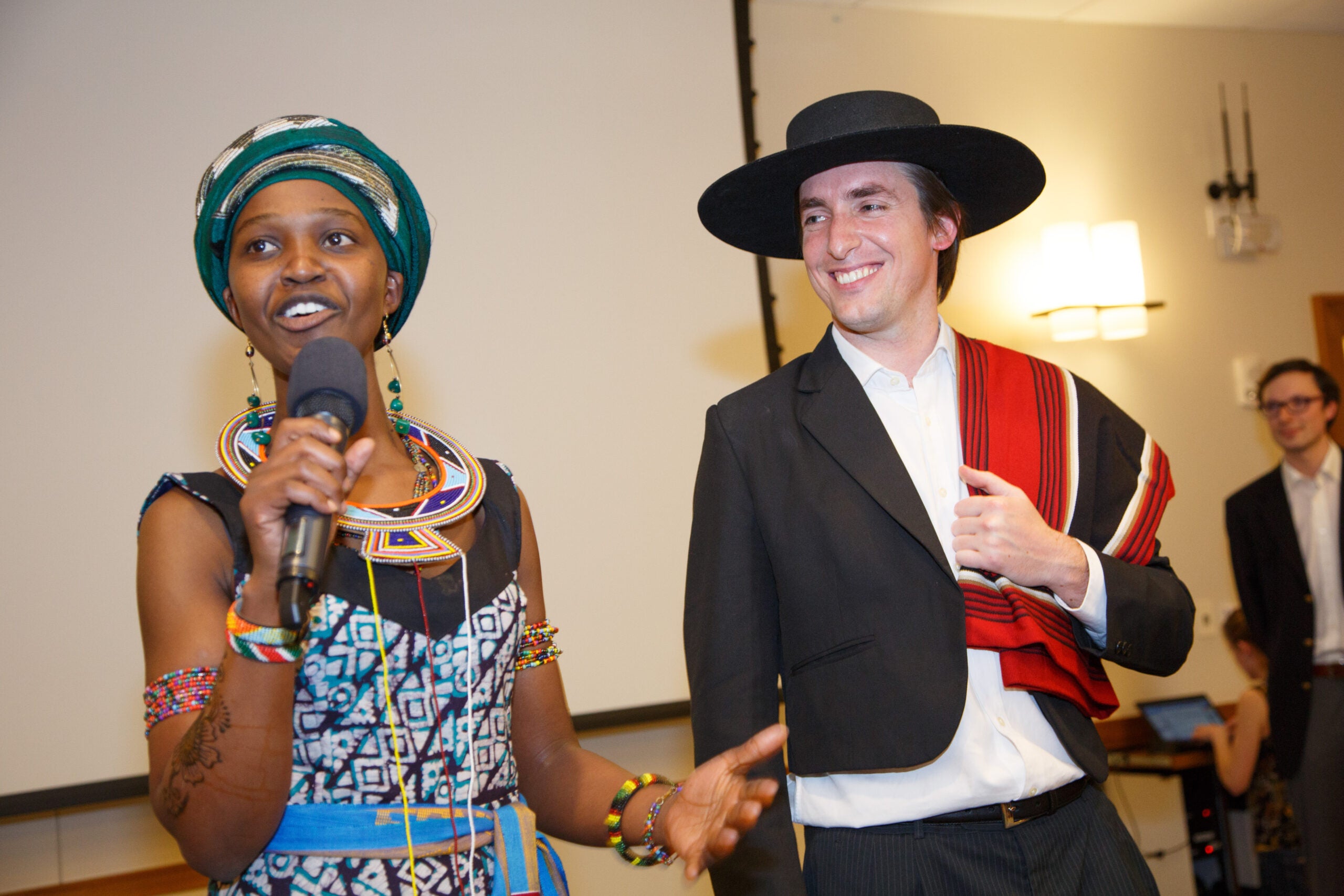 A man and a woman standing together in traditional dress