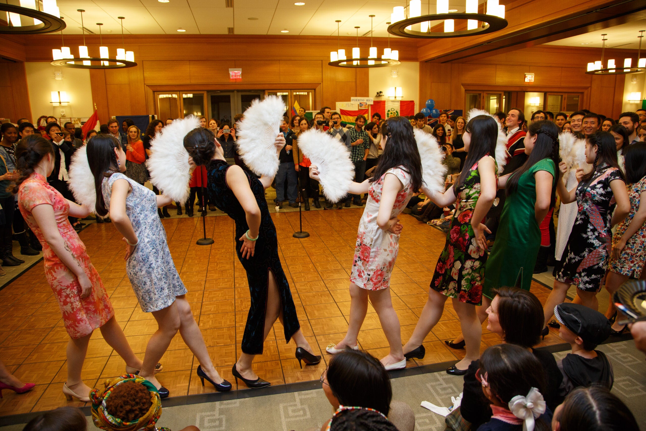 A group of women dancing in front of an audience