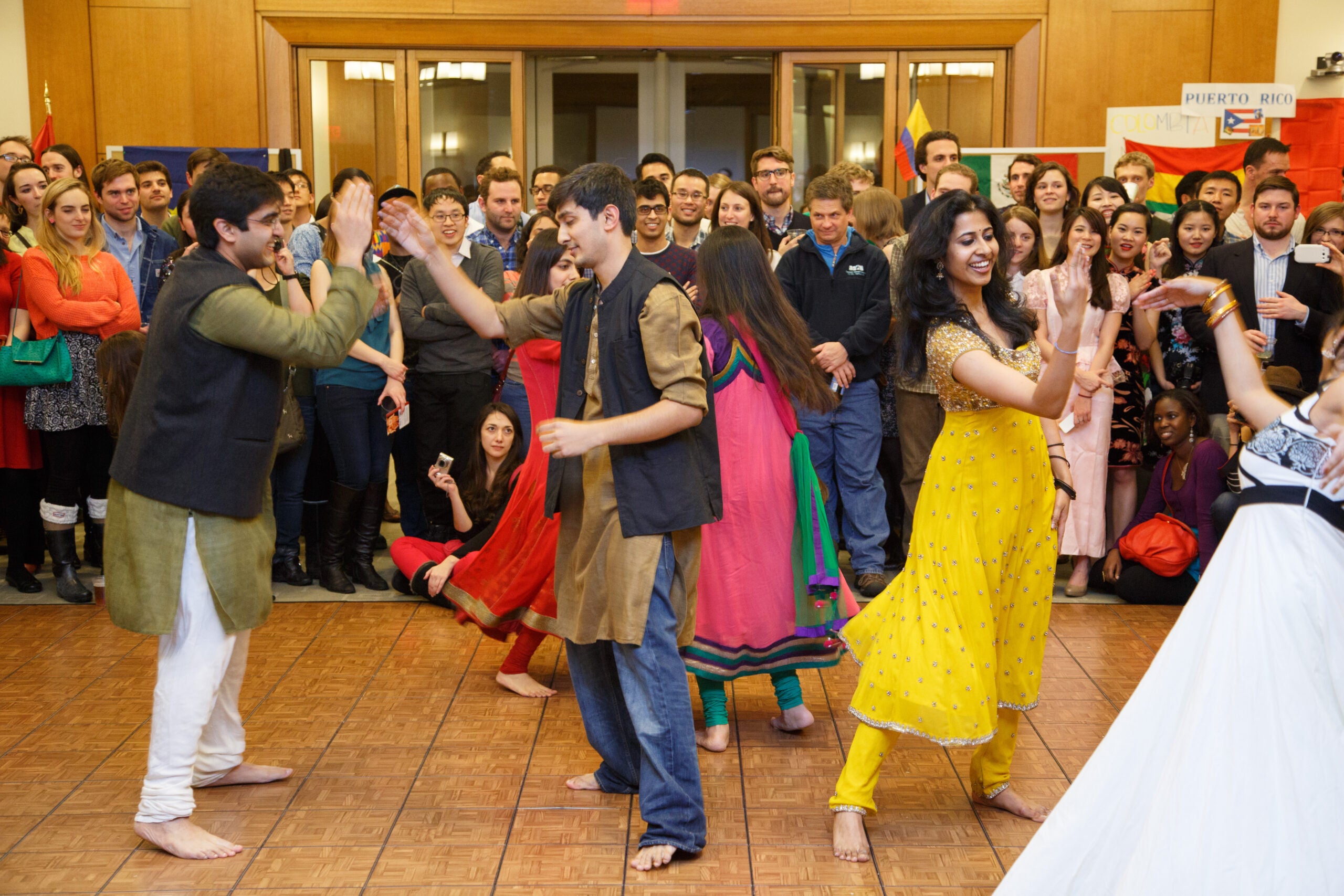 A group of people dancing in front of an audience