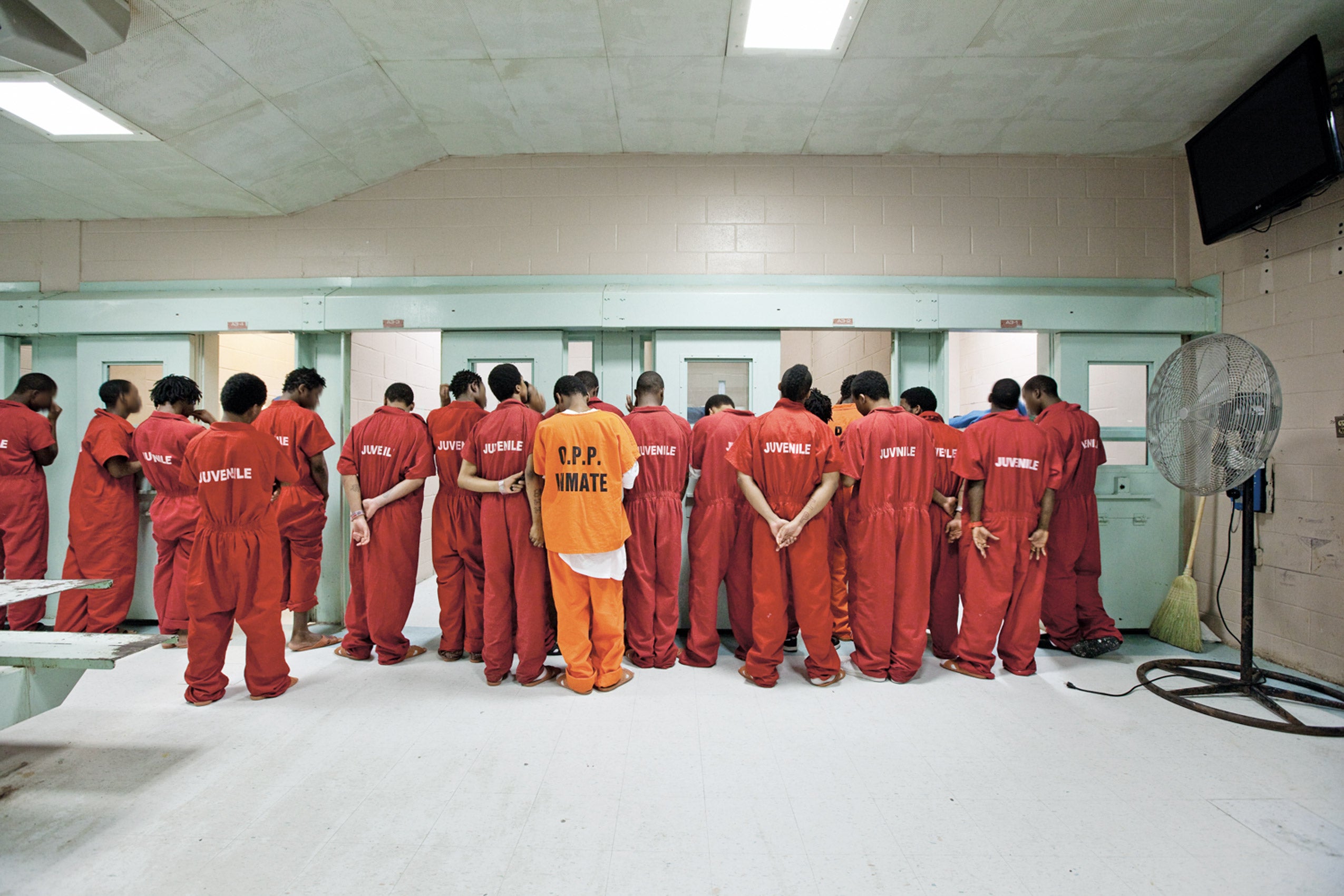 A group of young men in prison wear