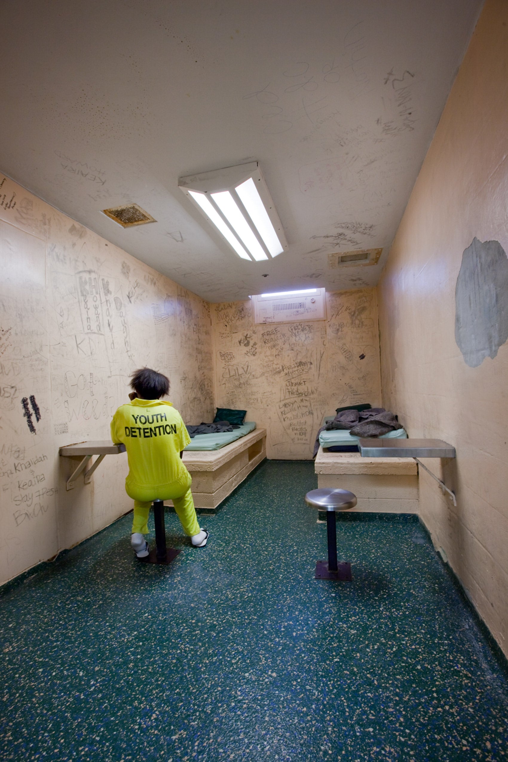 A child in a prison cell