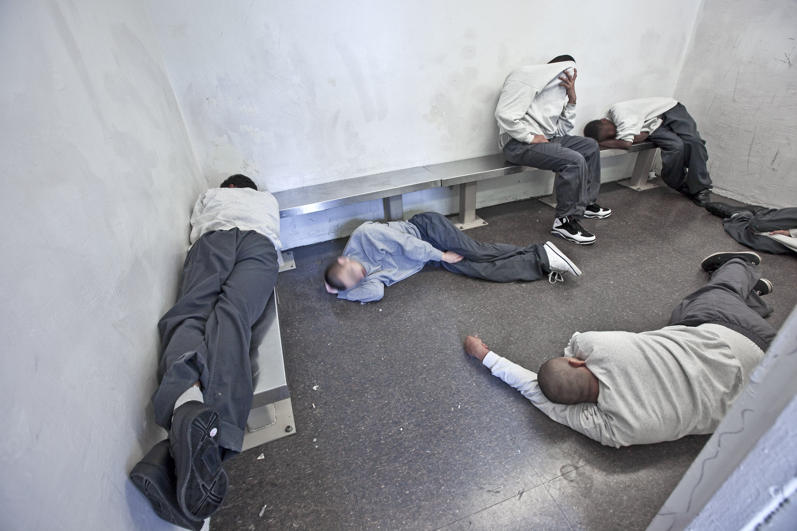 A group of young men in a prison cell