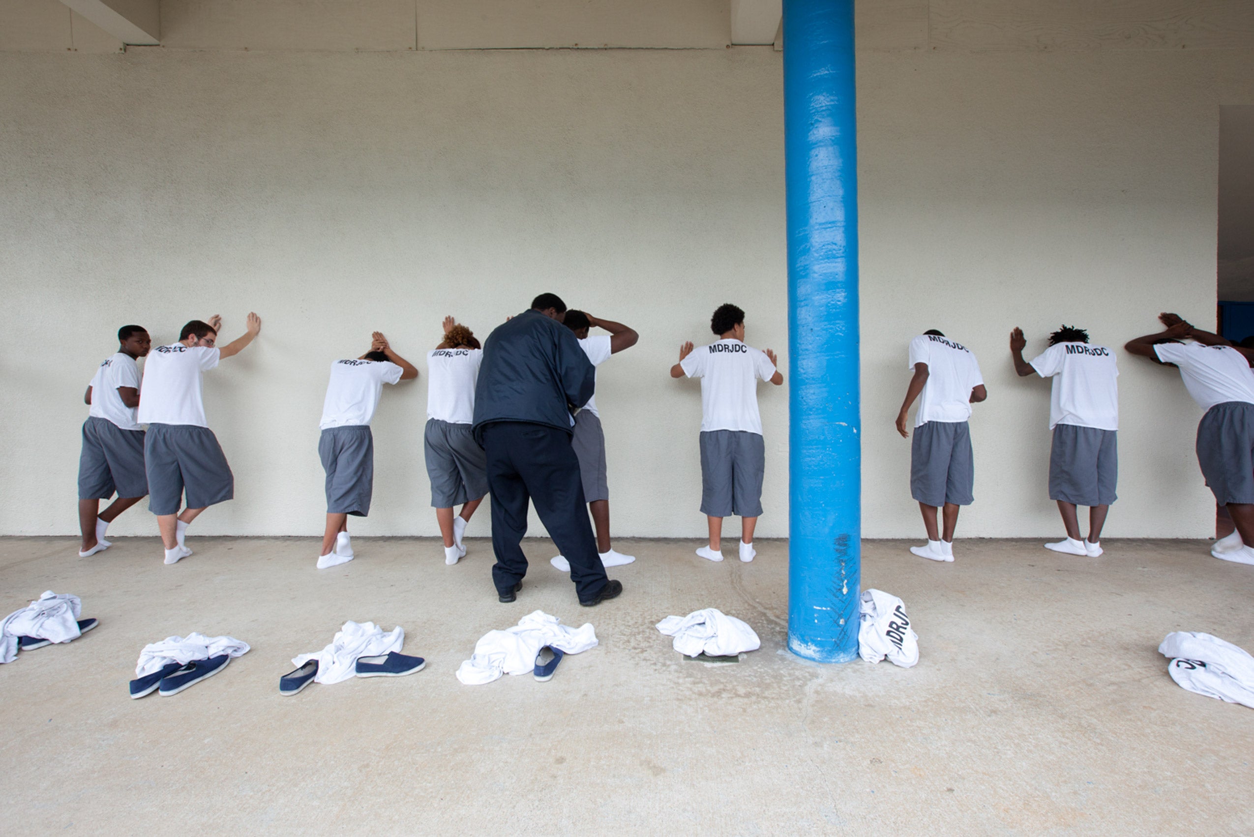 A group of young boys being pat down