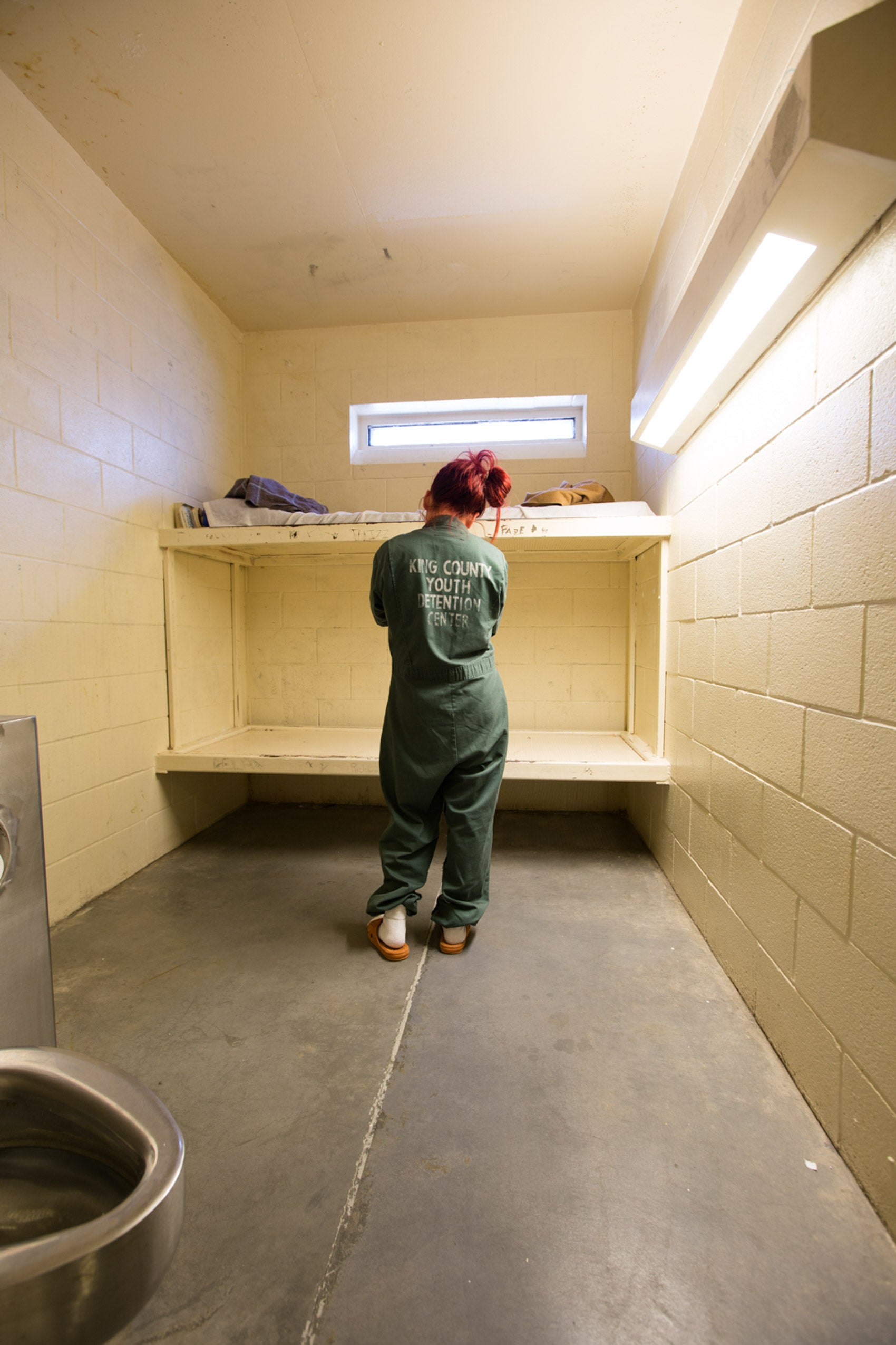A girl in a prison cell