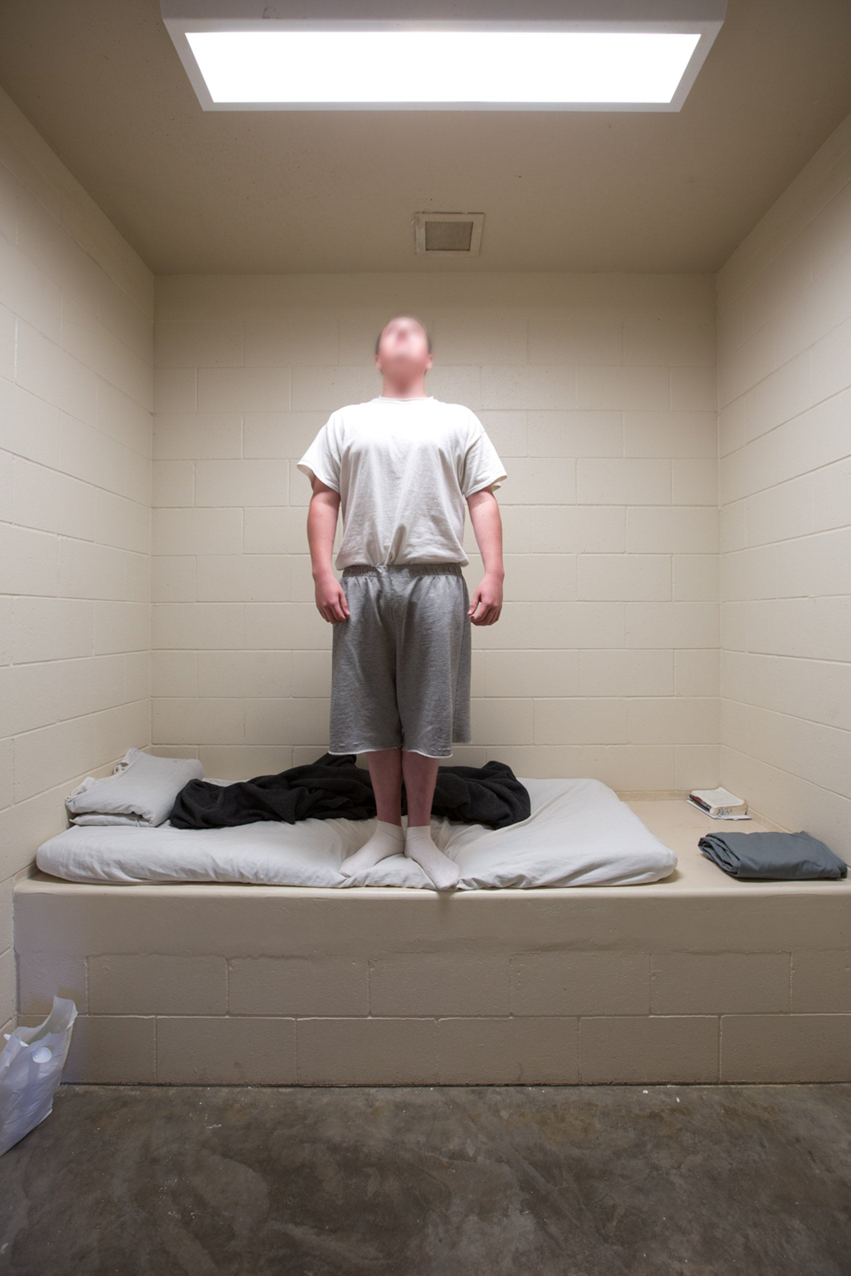 A boy in a prison cell