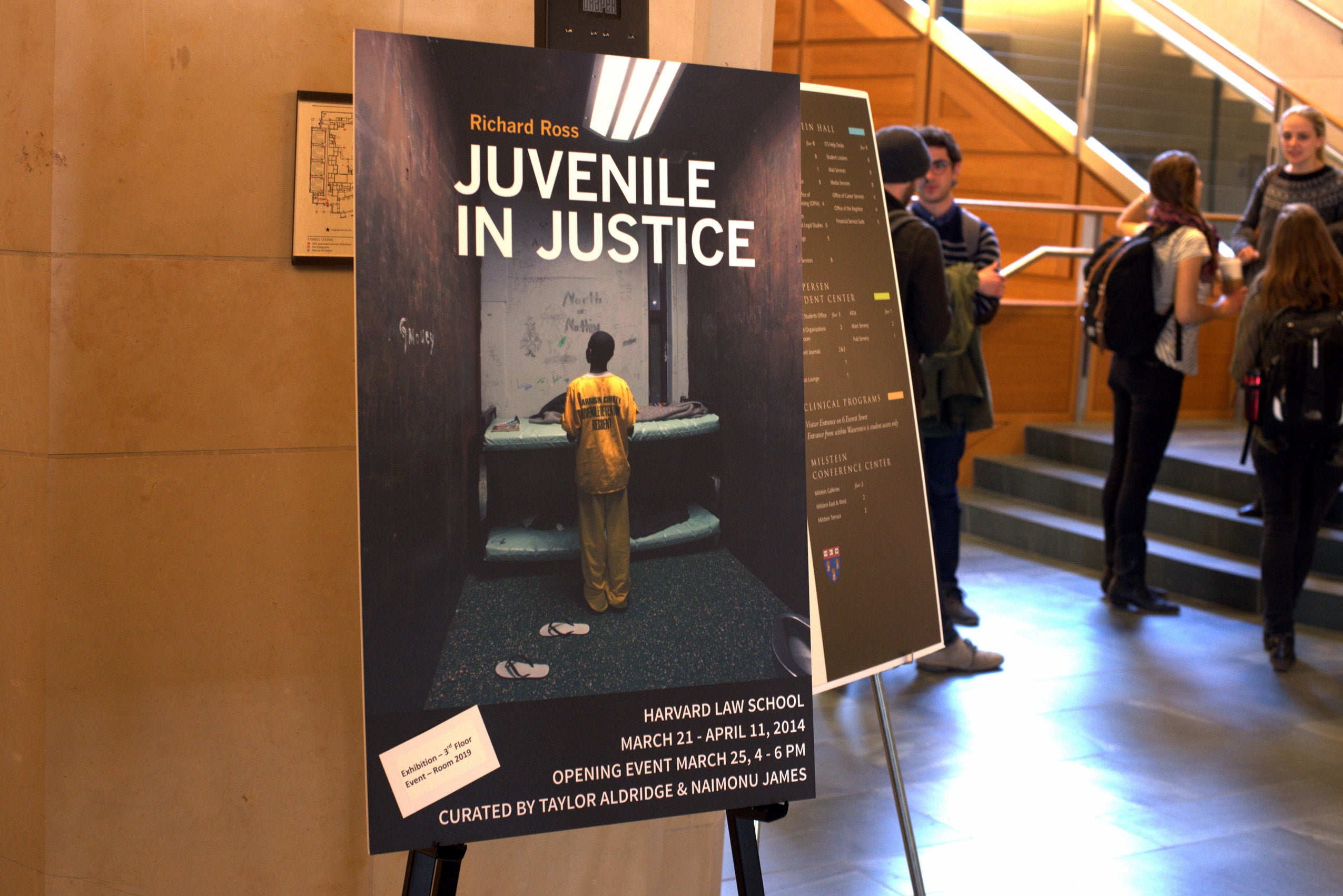 A poster of a child in prison wear entitled 'Juvenile in Justice'