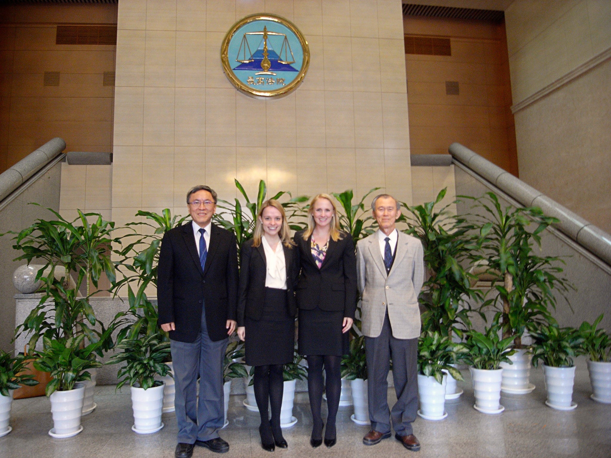 Two law students and two men posing together