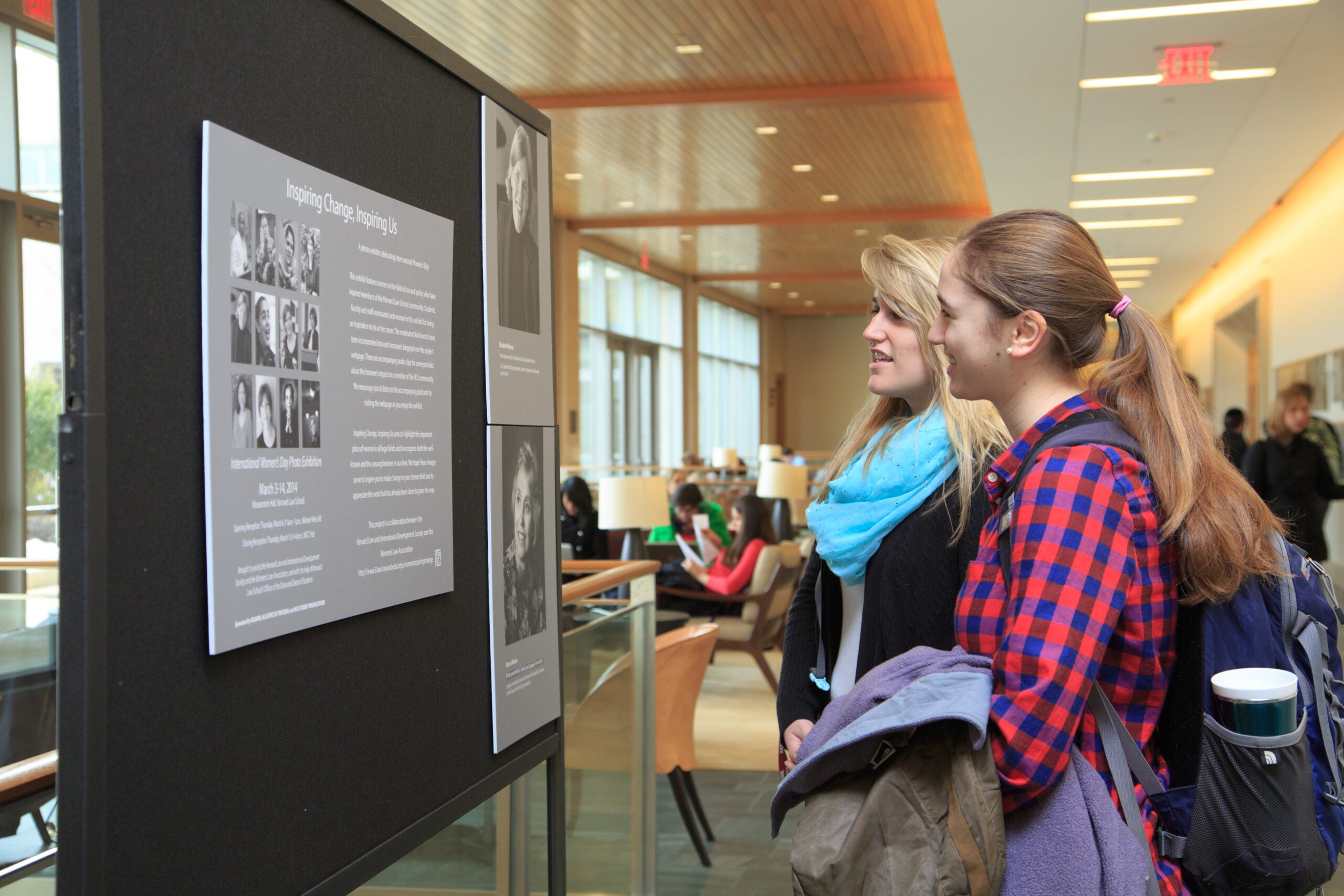 Two women looking at an exhibit