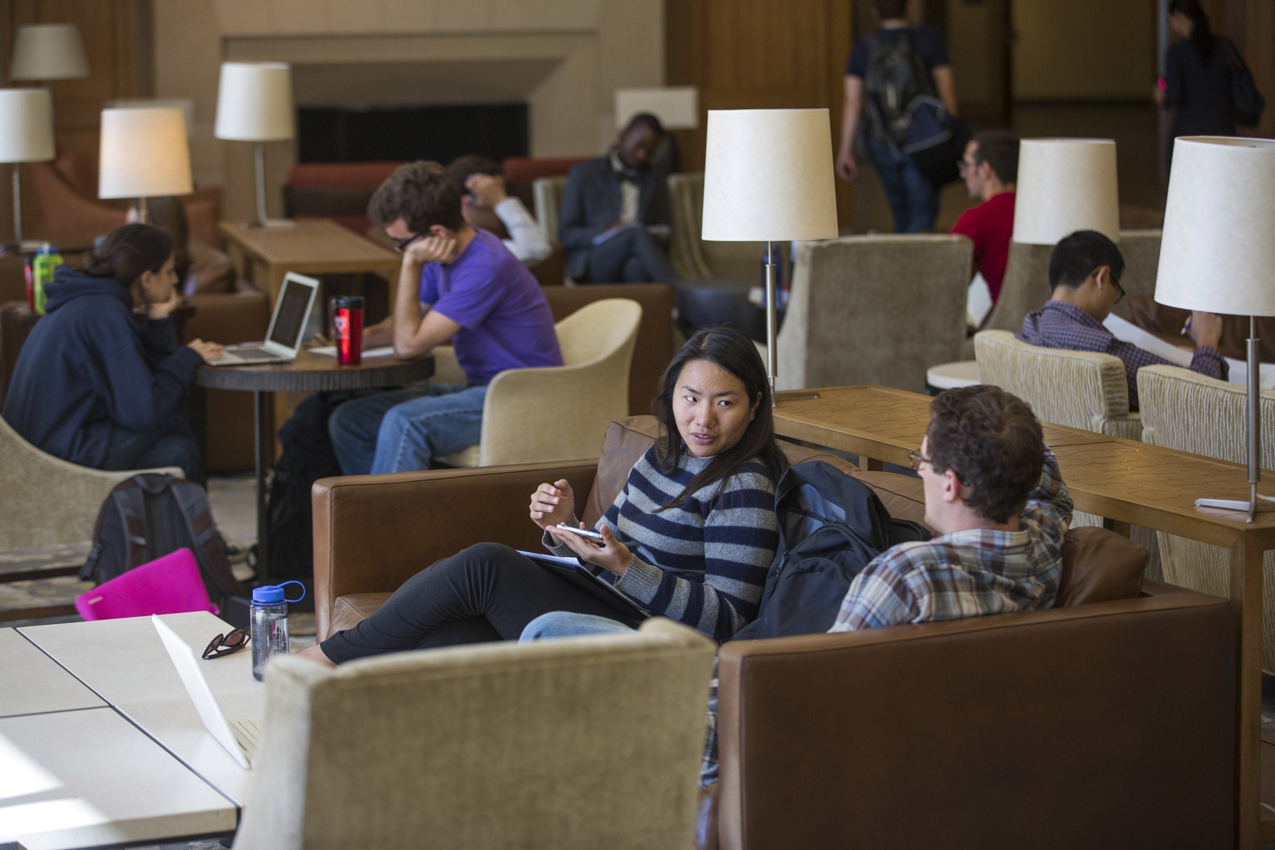 Students working and lounging in the Haas Lounge