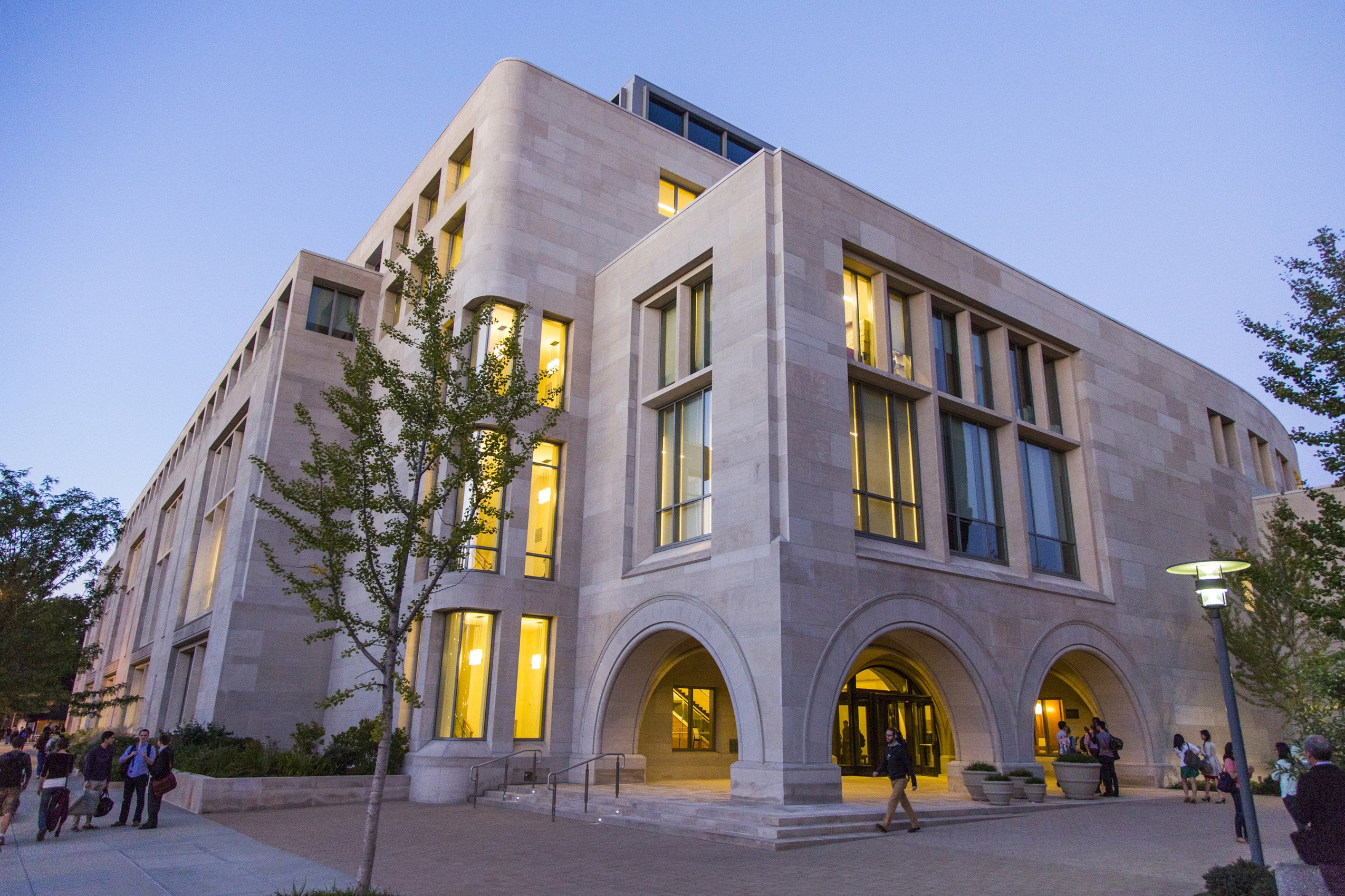 The exterior of Wasserstein Hall at dusk