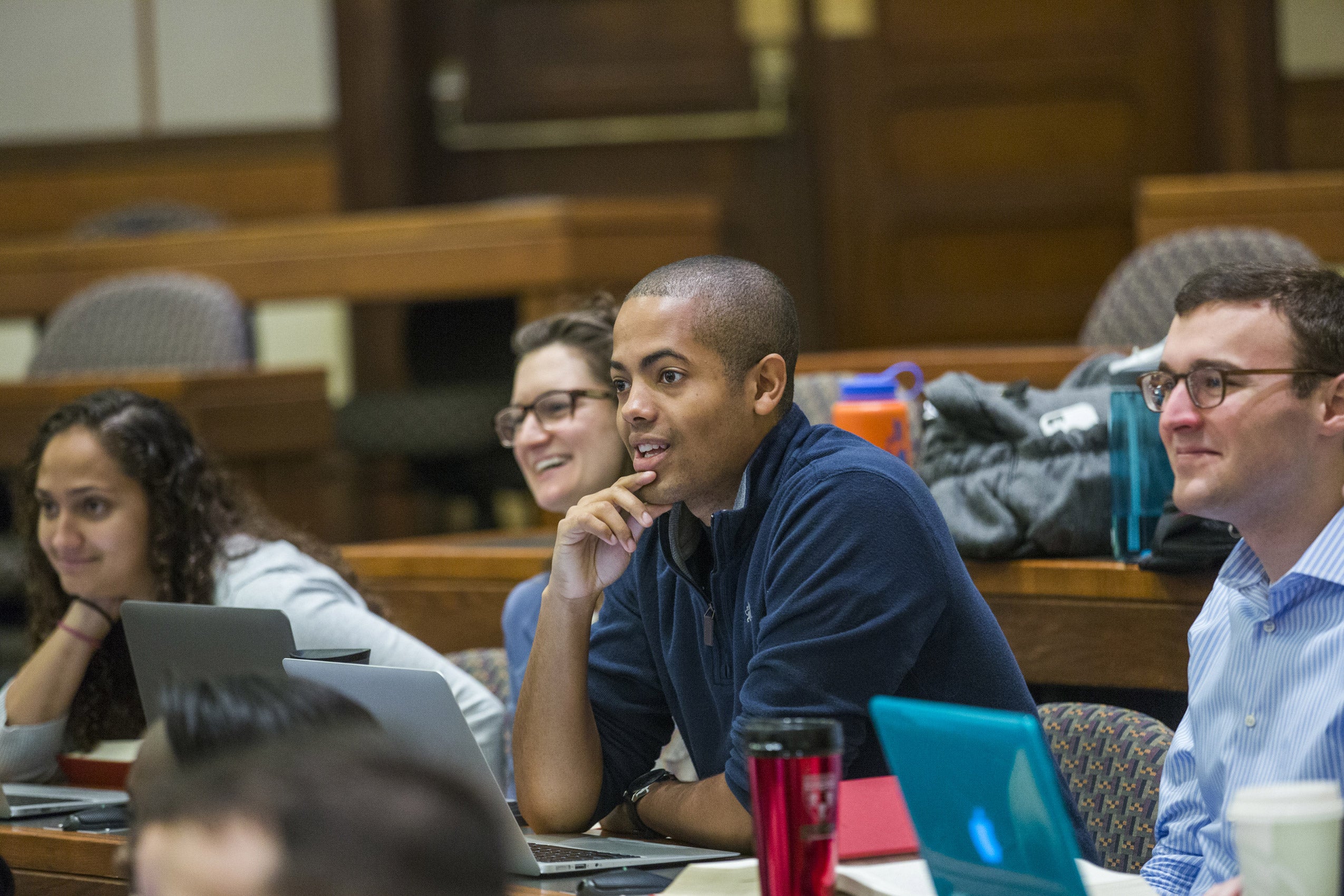 Students seated in a classroom listening to a lecture