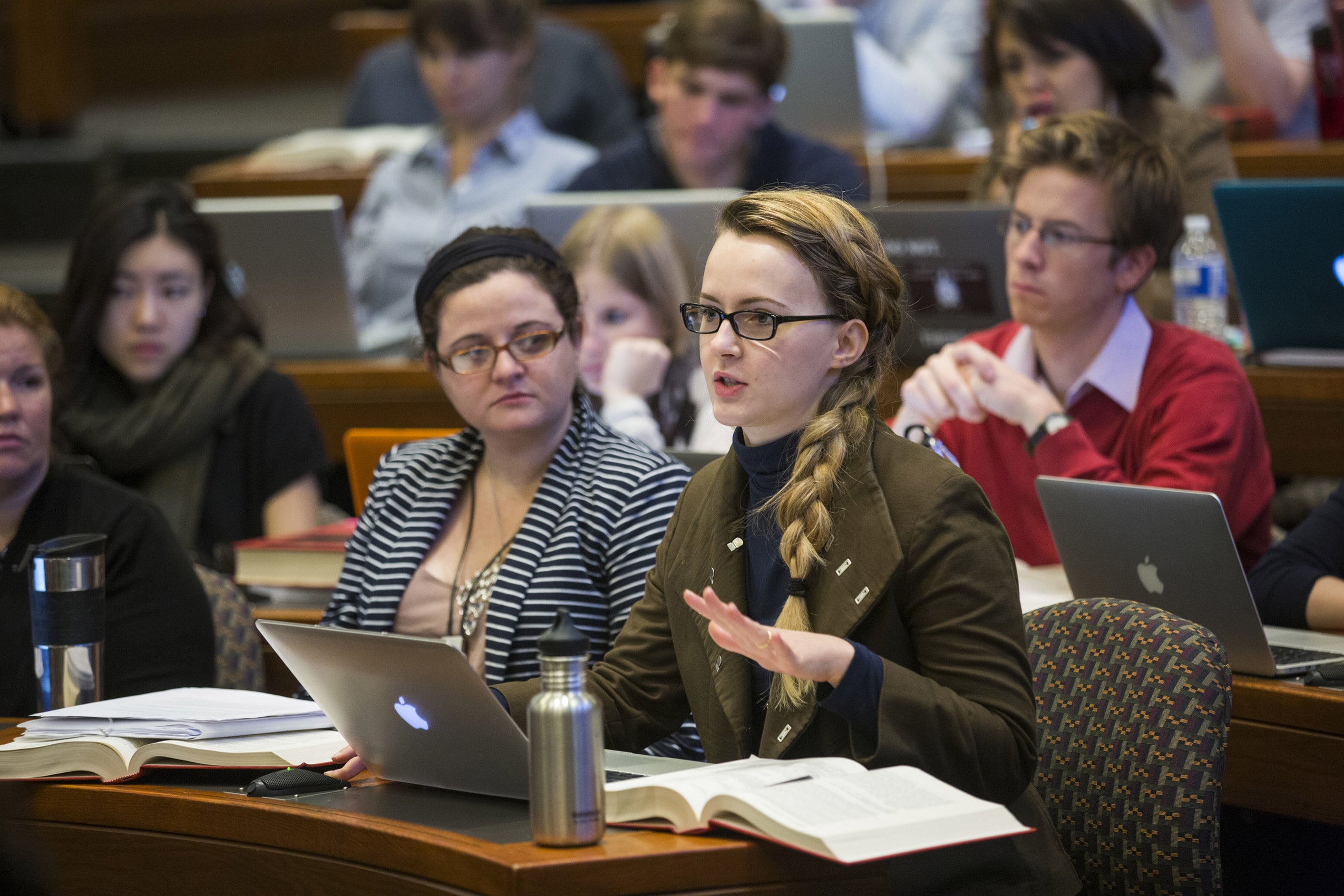 Students seated in a classroom participating in a lecture