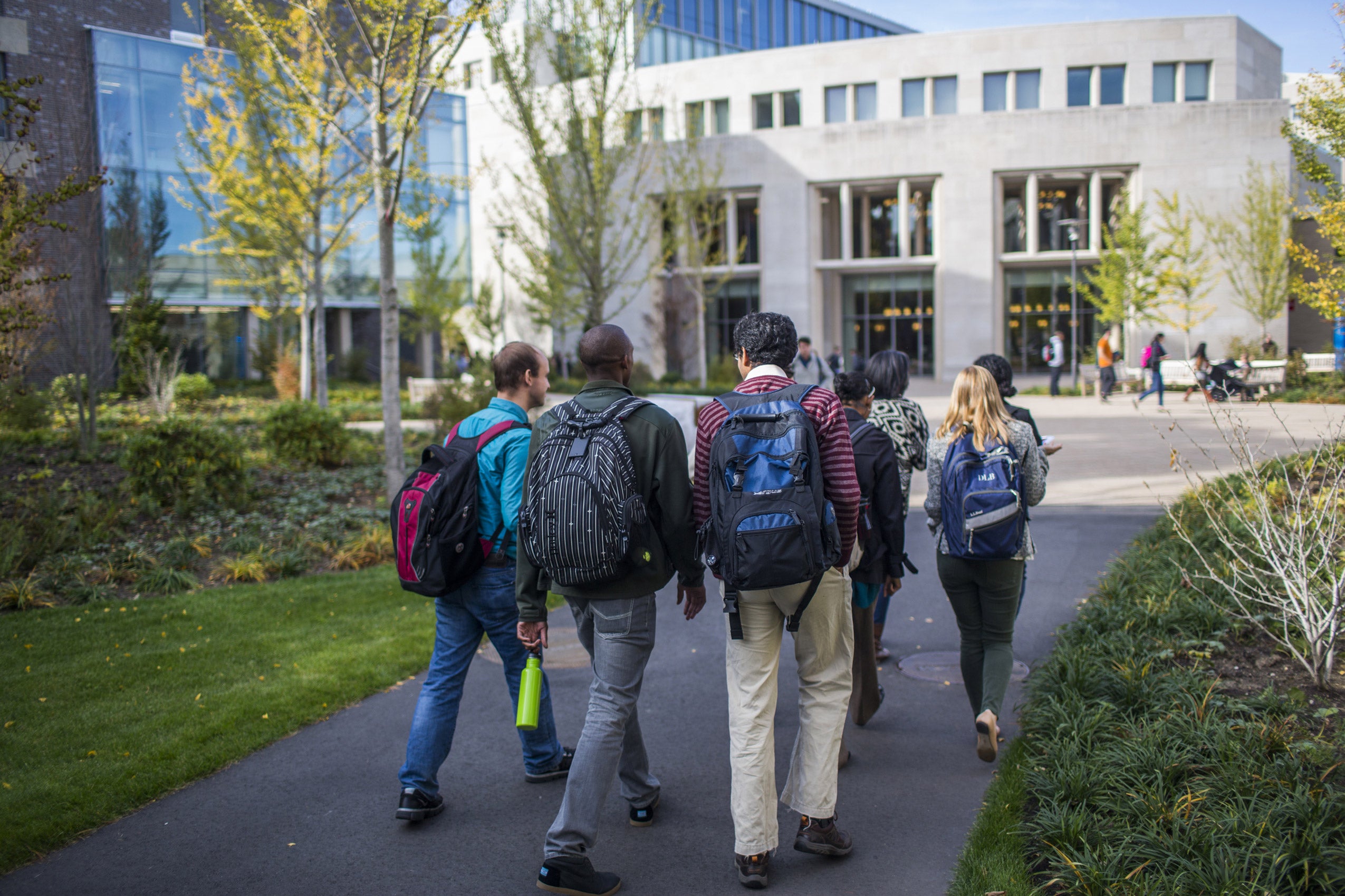 Students walking as a group outside towards the WCC