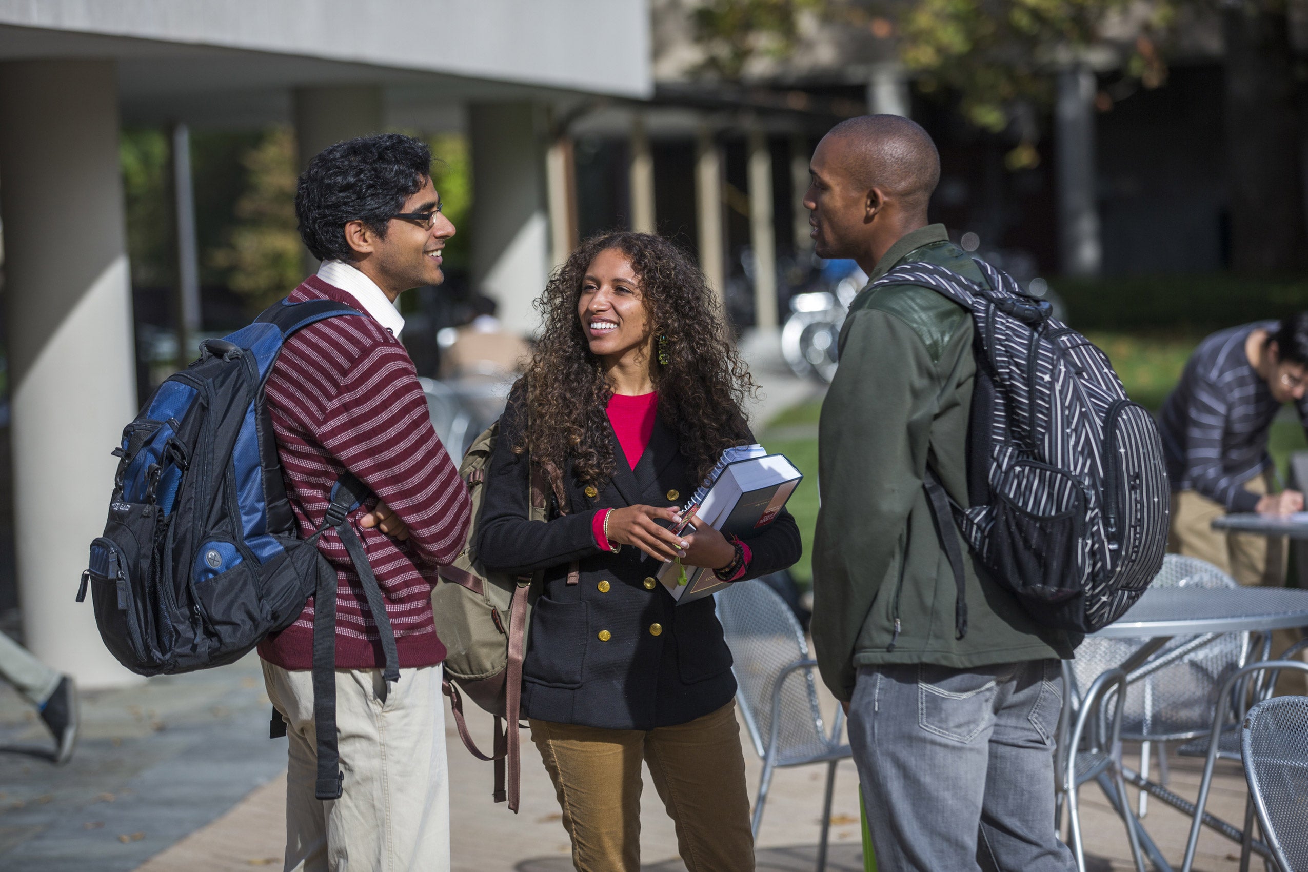 Three students having a conversation
