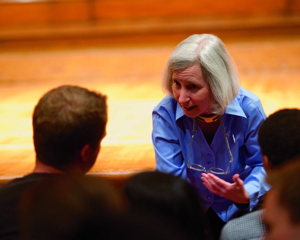Martha Minow speaking to someone