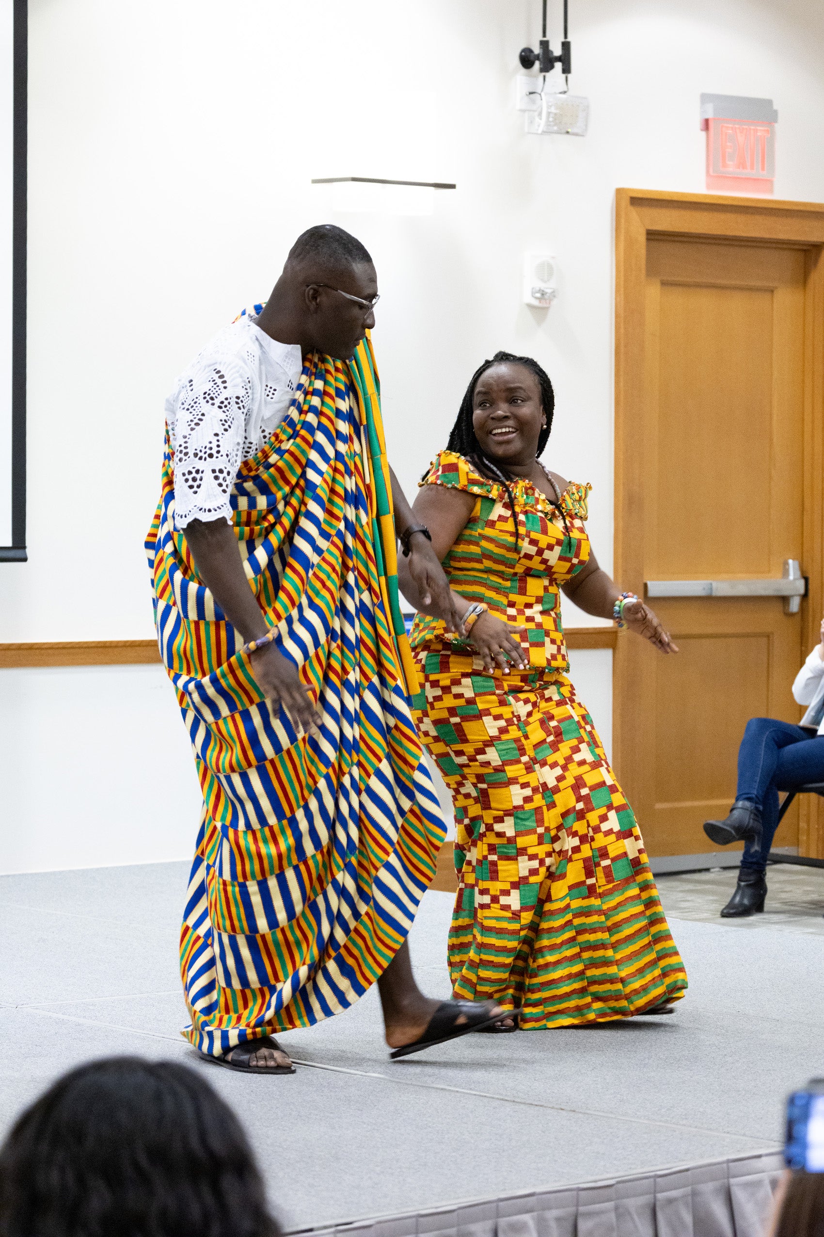 A man and a women dancing on a stage