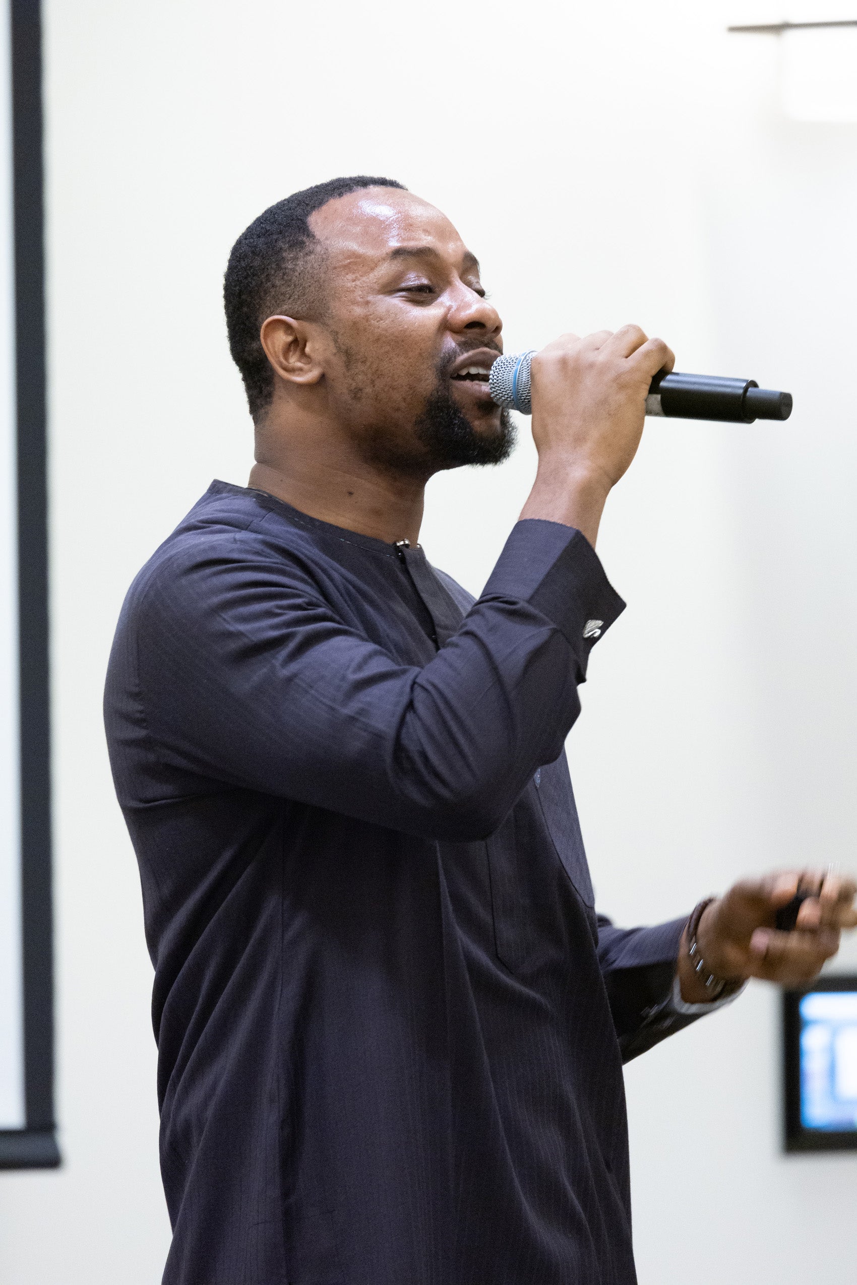 Man singing into a microphone