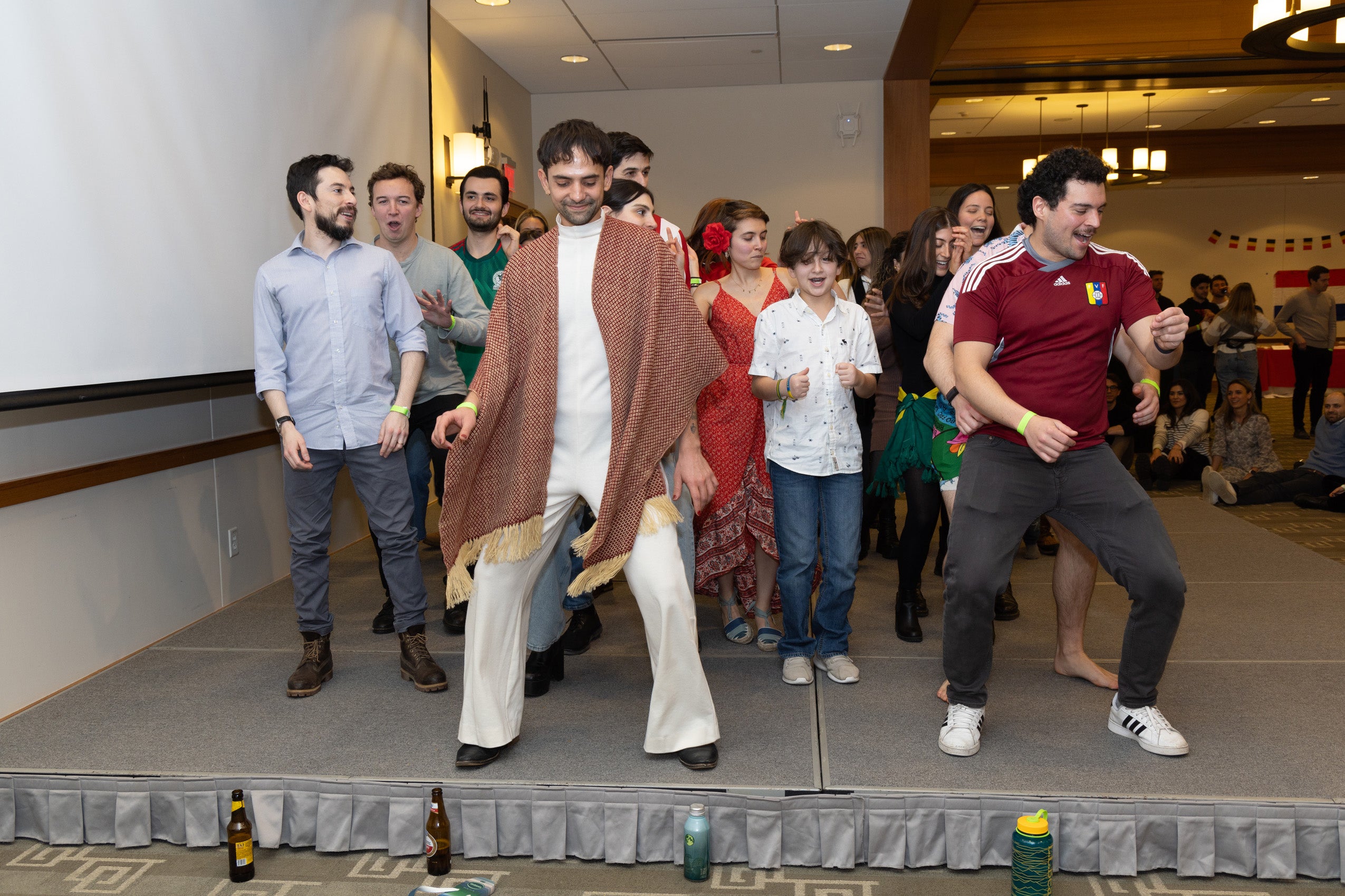 Students dance on a stage