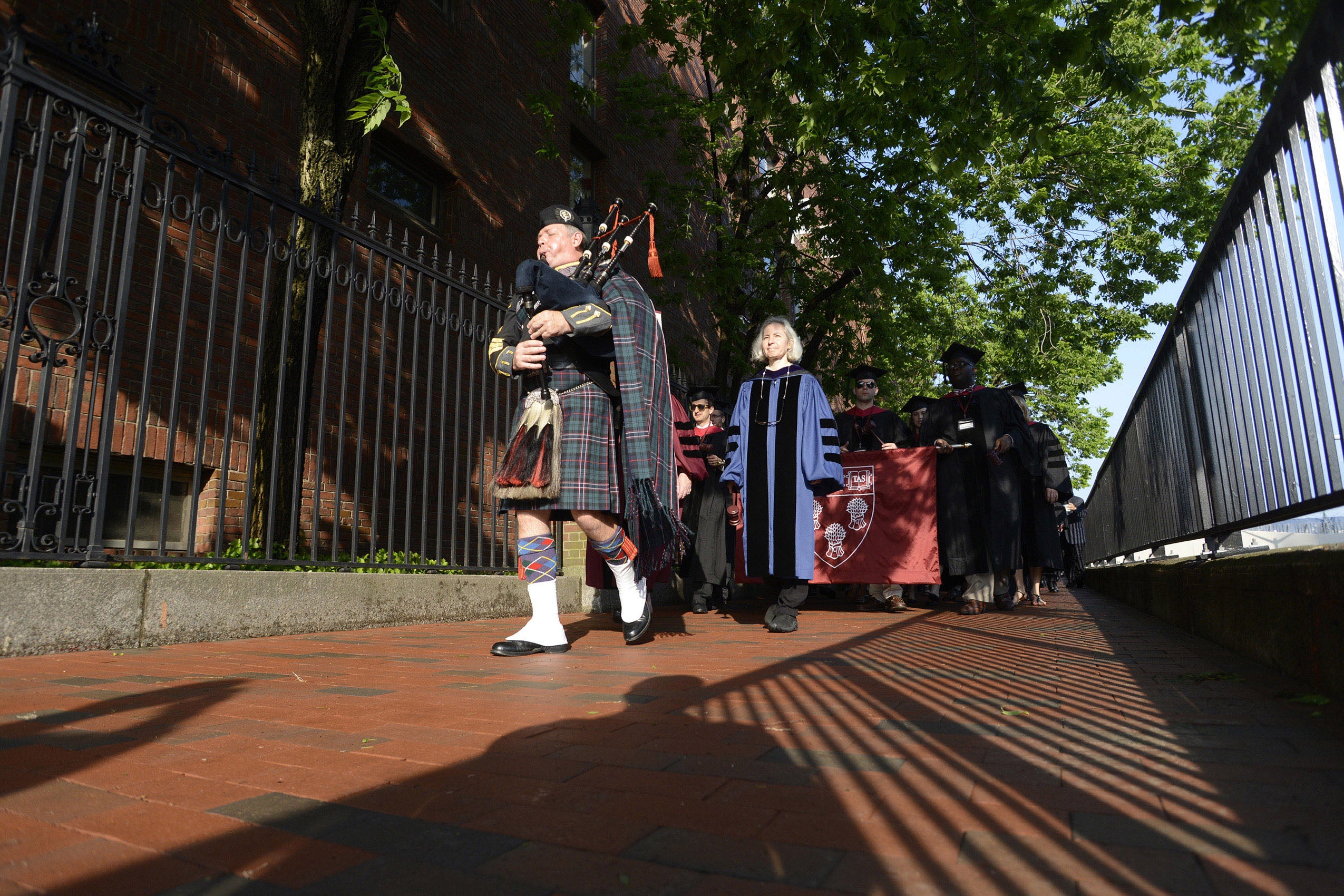 Bagpipe player leads procession