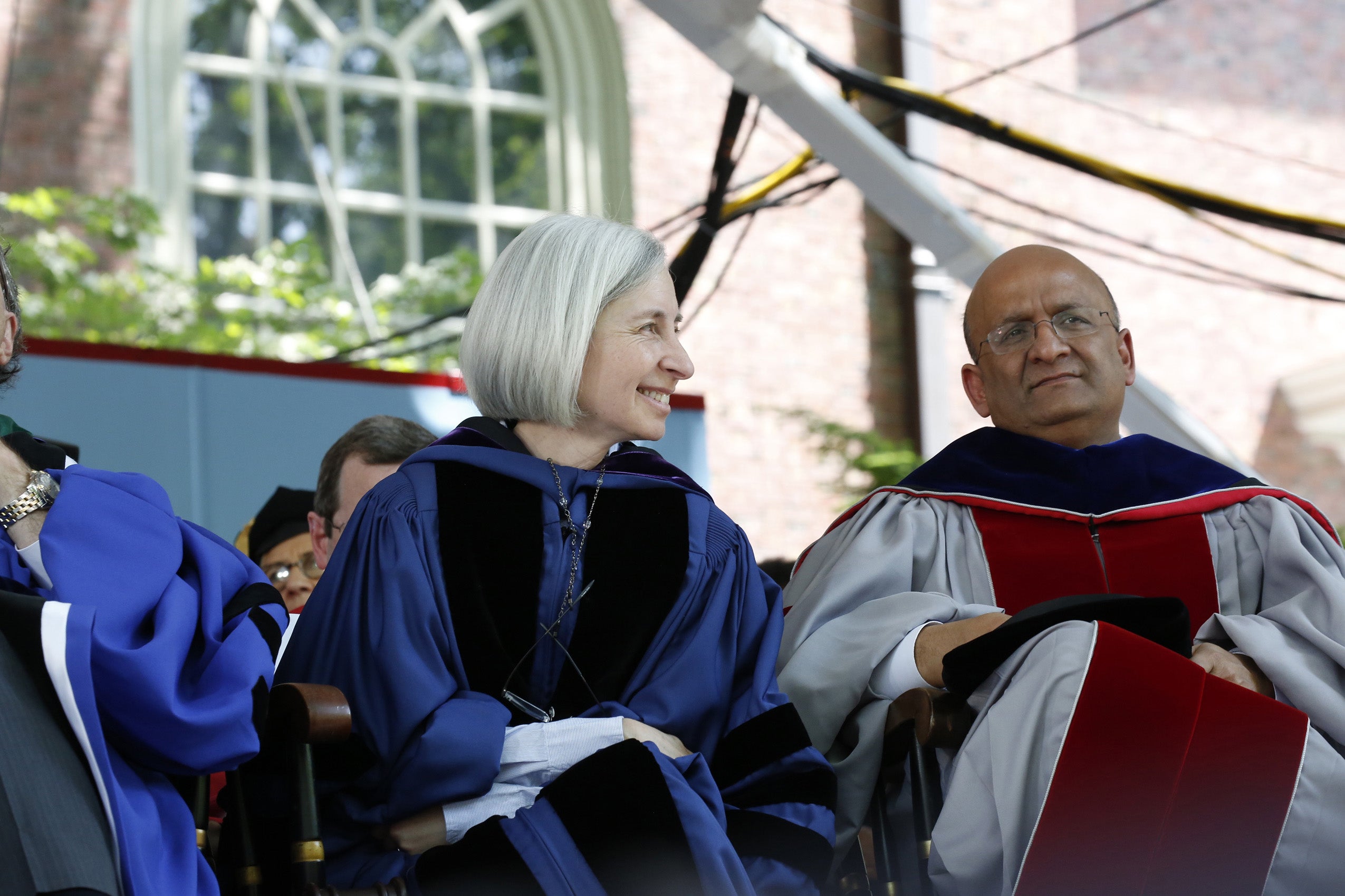 Faculty converse during Commencement