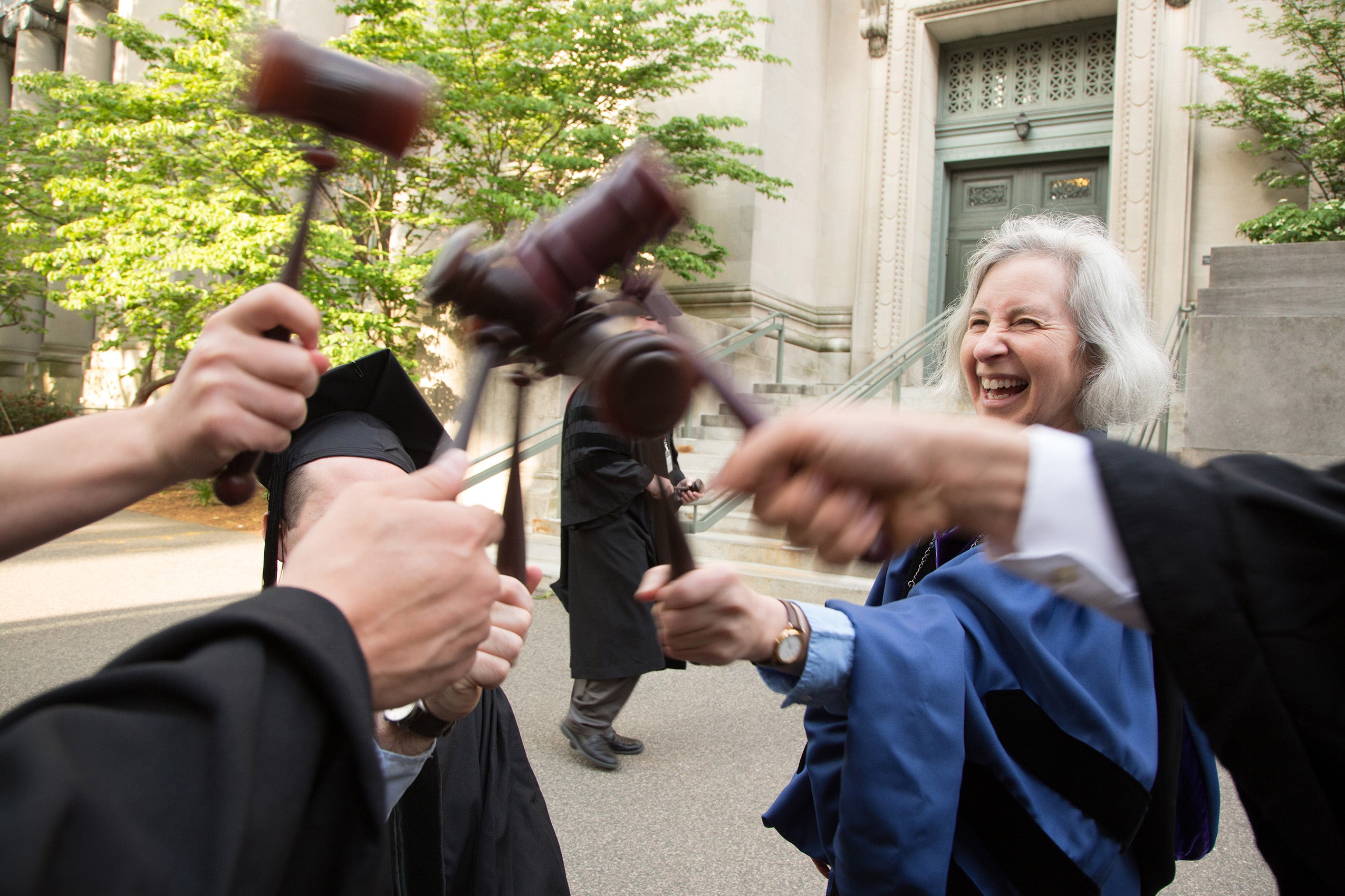 Minow and other faculty bang gavels together