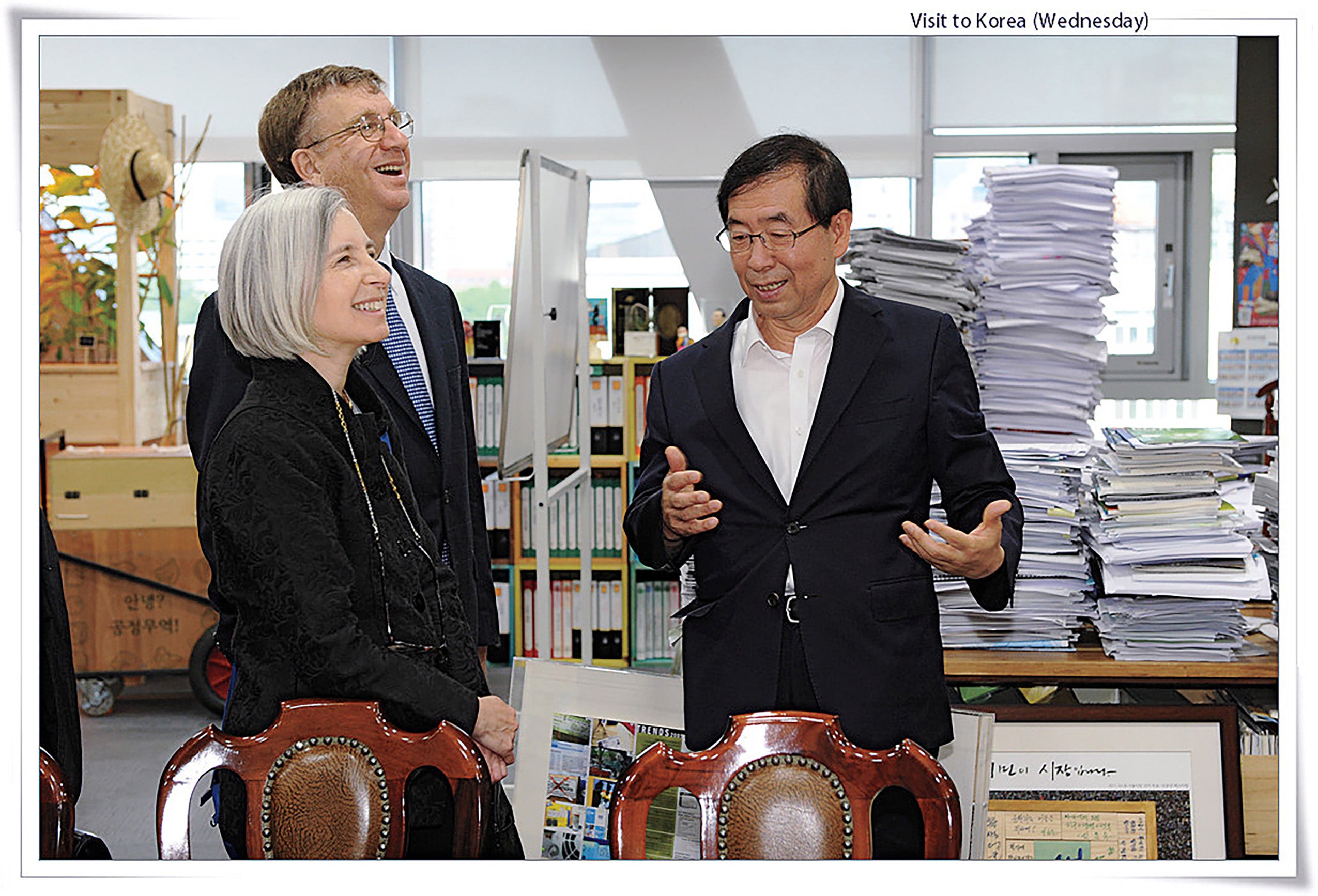 Martha Minow and William Alford listening to man