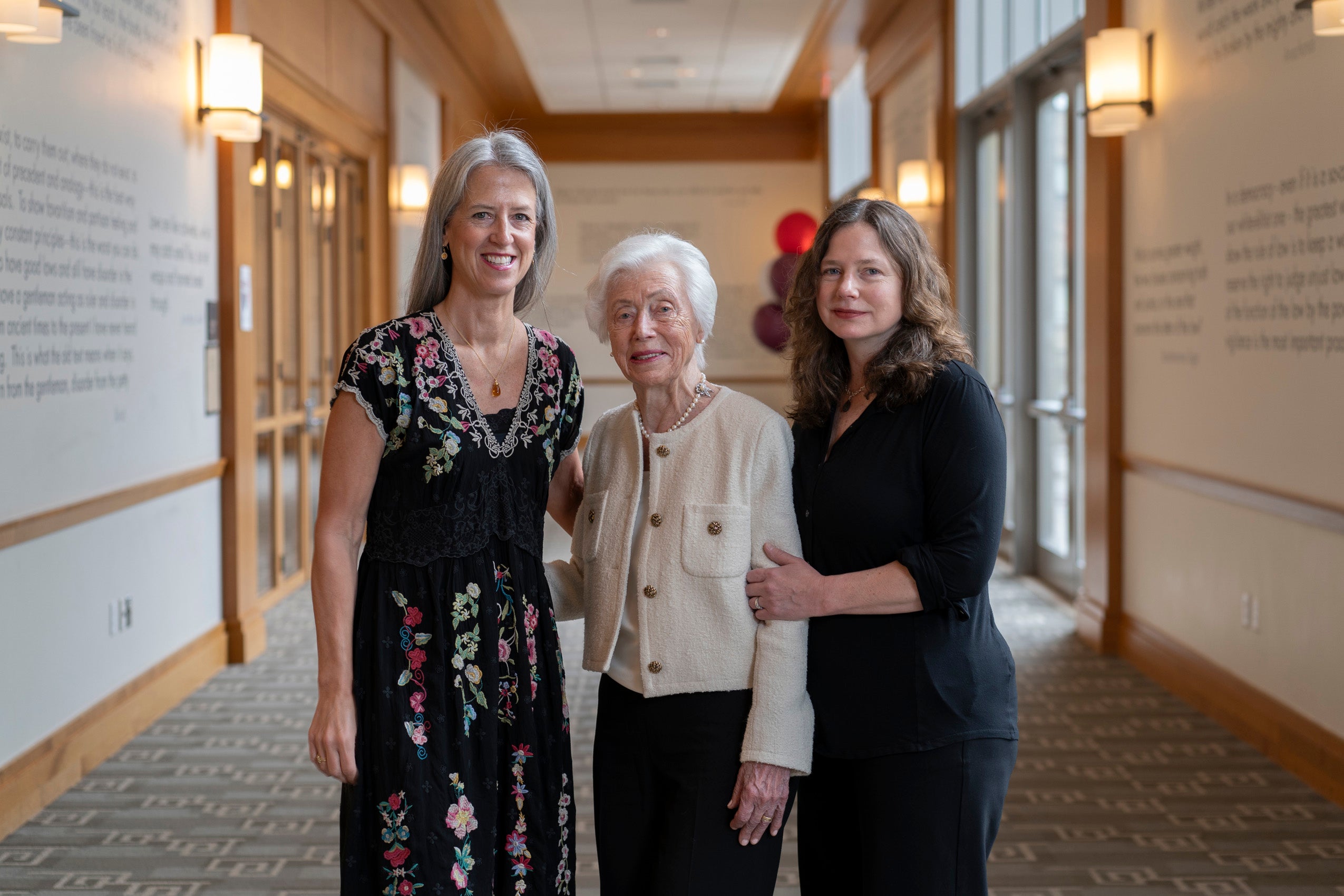 Portrait of three women in a hallway