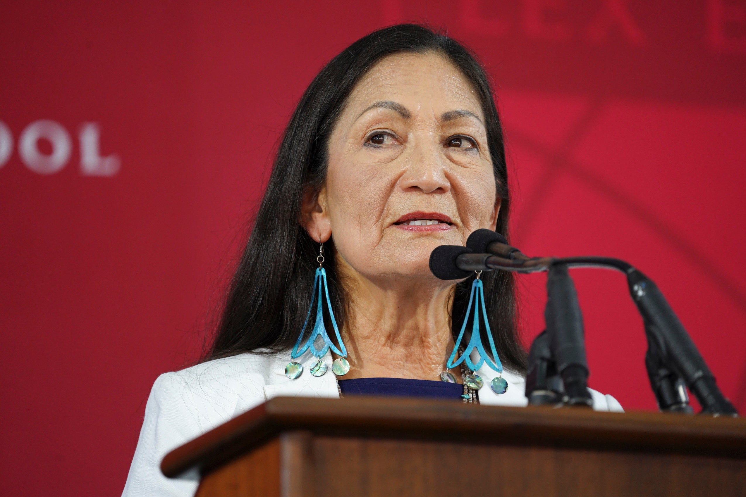 A woman speaking at a podium