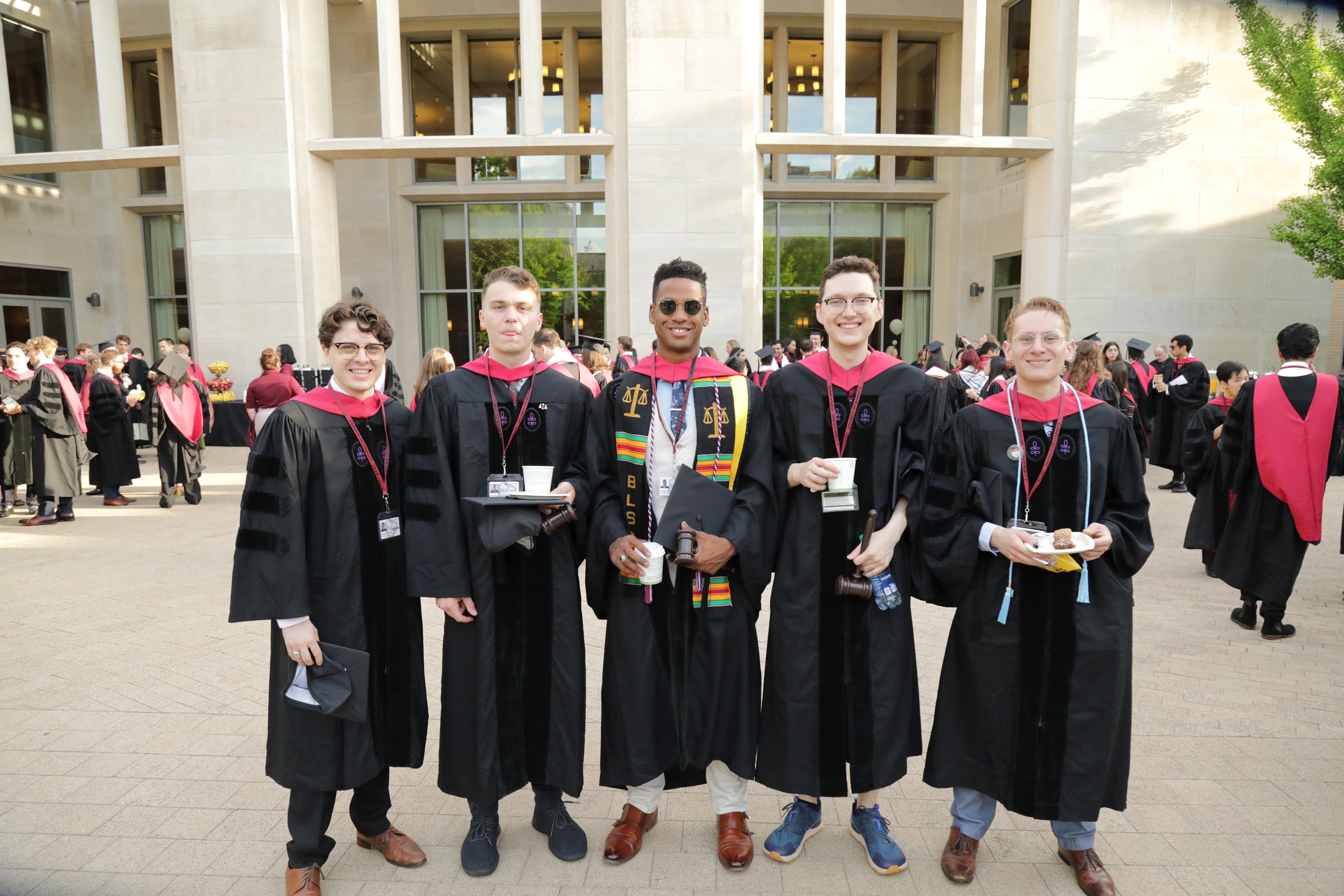 Group of five people in Commencement regalia